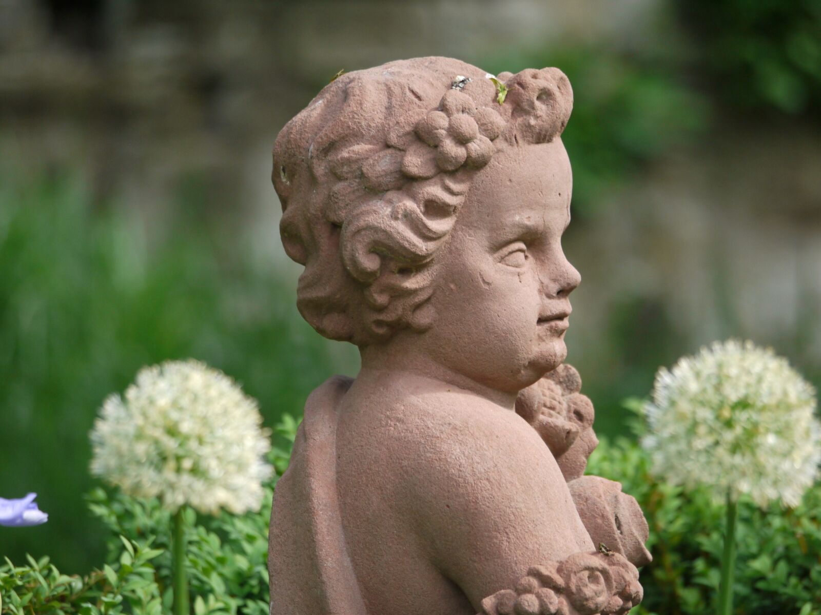 Panasonic Lumix DMC-G1 sample photo. Stone, sculpture, cherub photography