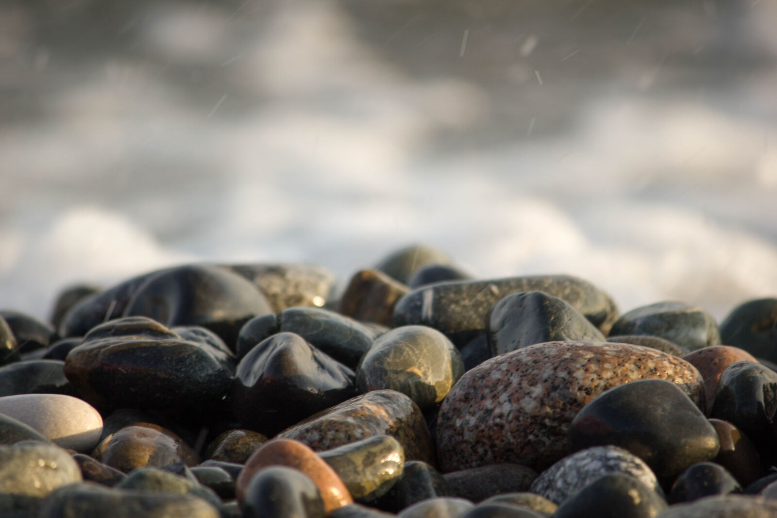 Canon EF-S 55-250mm F4-5.6 IS sample photo. Water, stones, sea photography