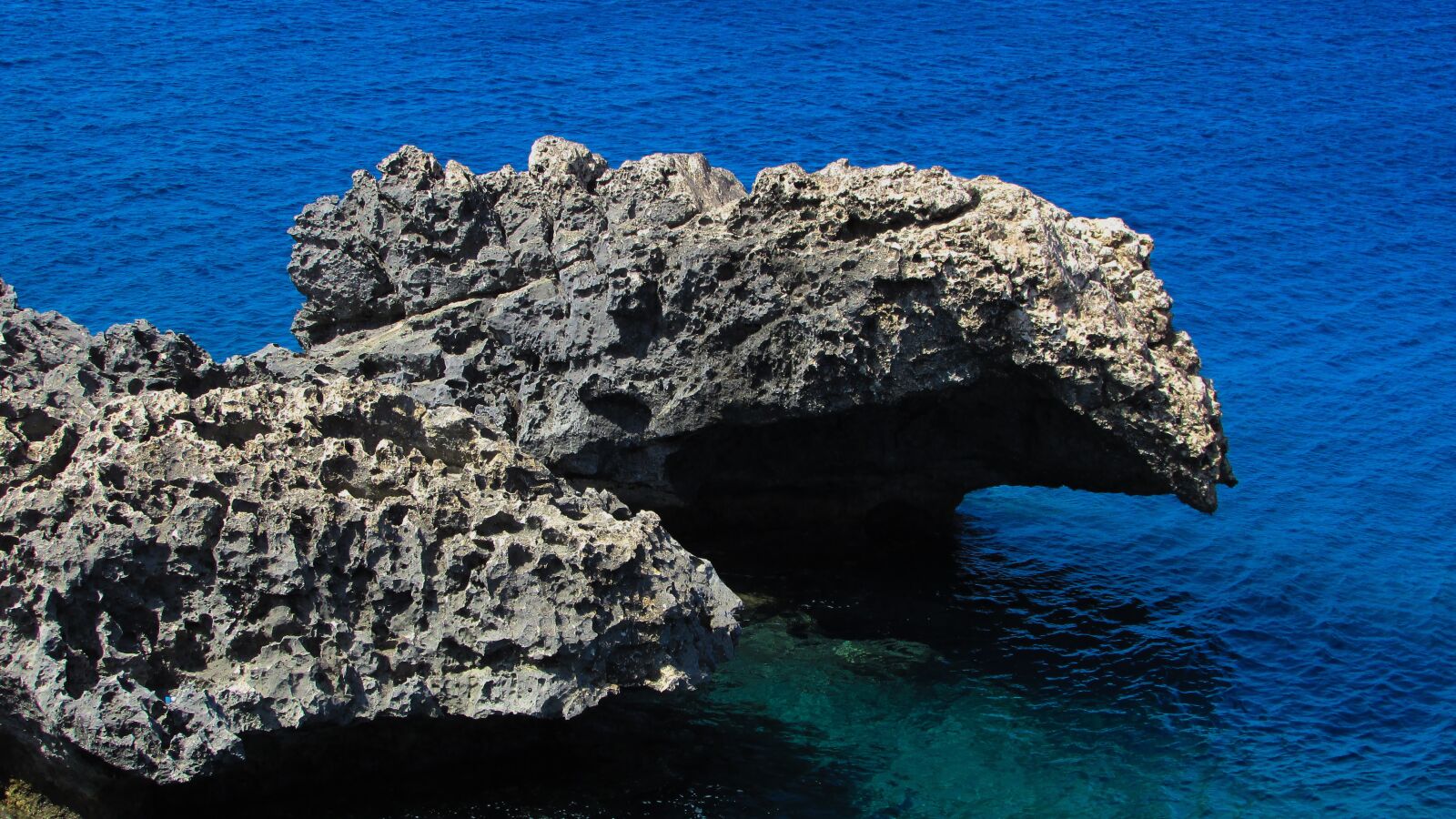 Canon PowerShot SX400 IS sample photo. Rock, sea, blue photography
