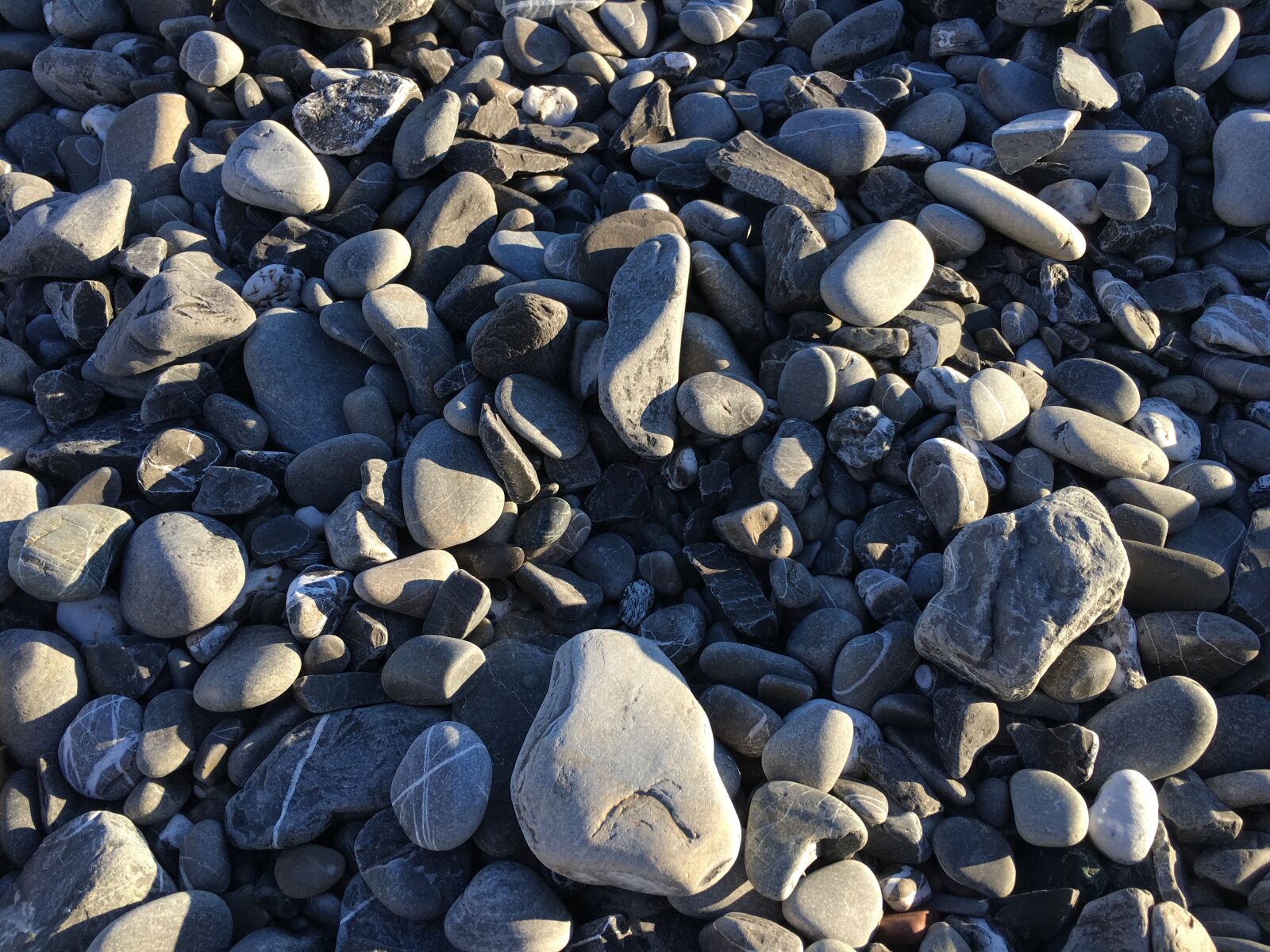 Apple iPhone 6s sample photo. Pebbles, beach, sea photography
