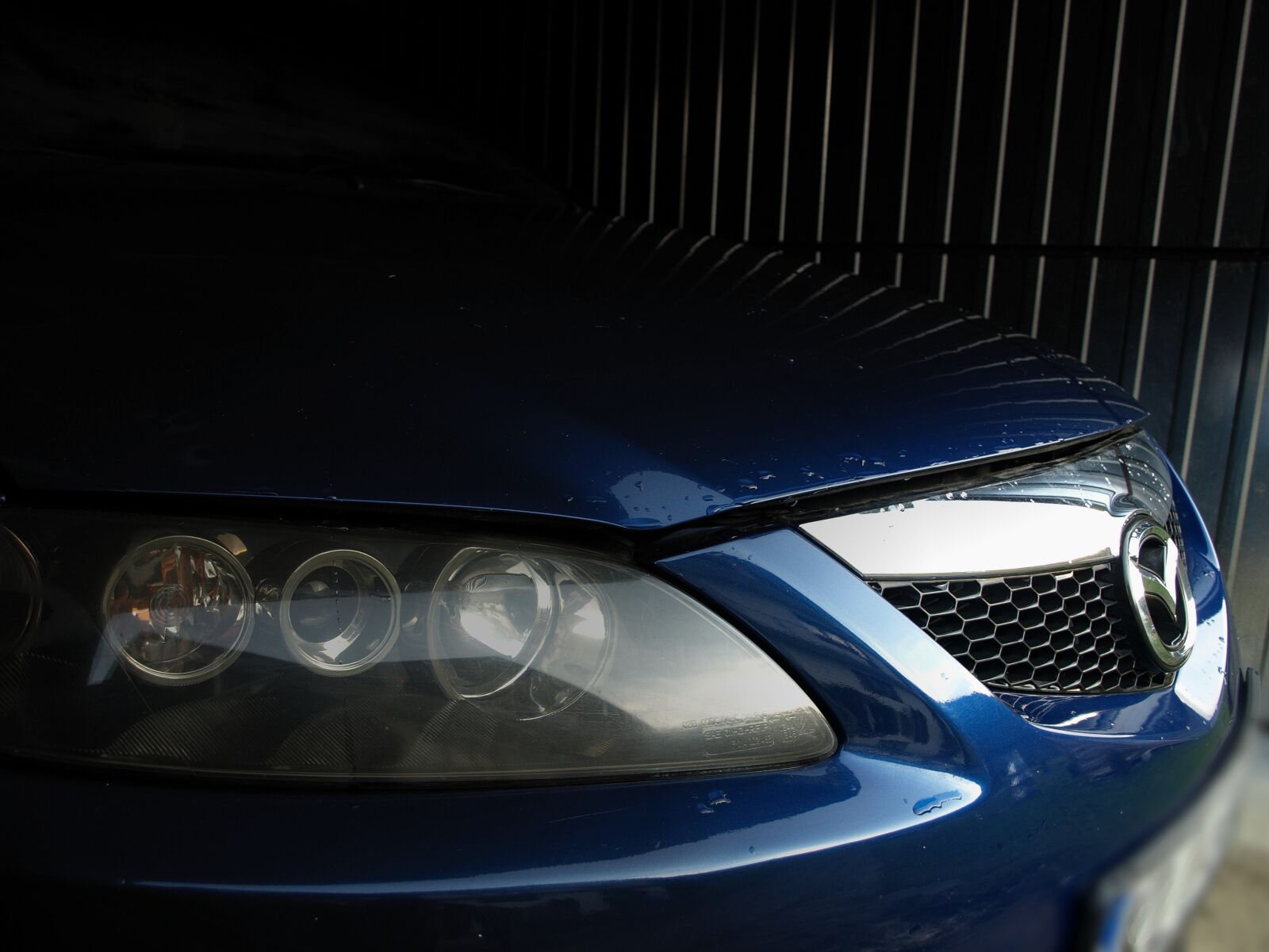Olympus E-510 (EVOLT E-510) sample photo. Car, mazda, reflector photography