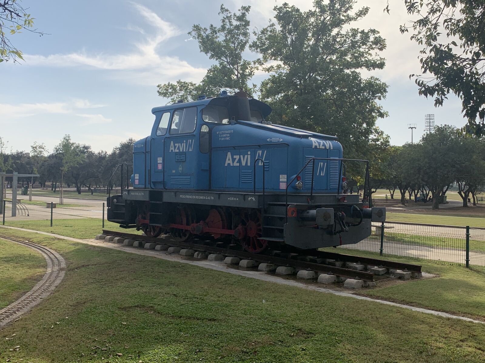 iPhone XS Max back dual camera 4.25mm f/1.8 sample photo. Train, park, blue photography