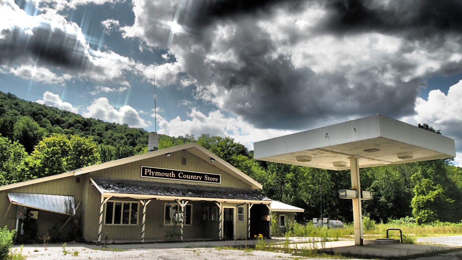 Olympus PEN E-PL3 sample photo. Sky, petrol stations, decay photography