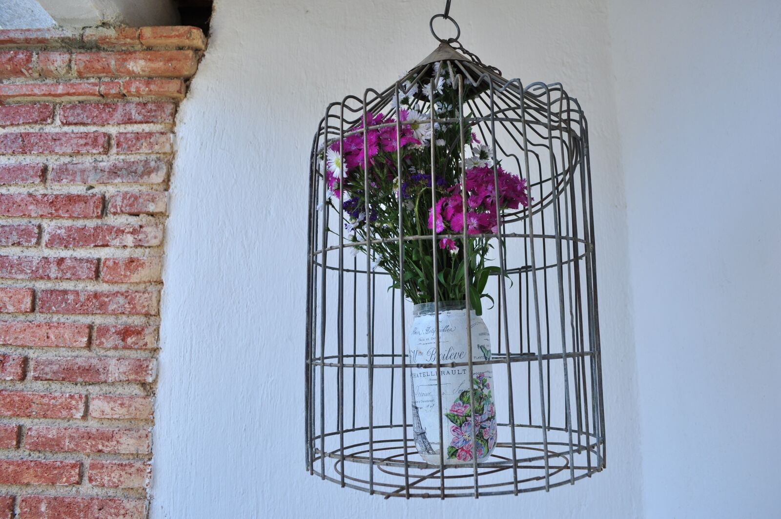 Nikon D90 sample photo. Cage, flowers, bricks photography