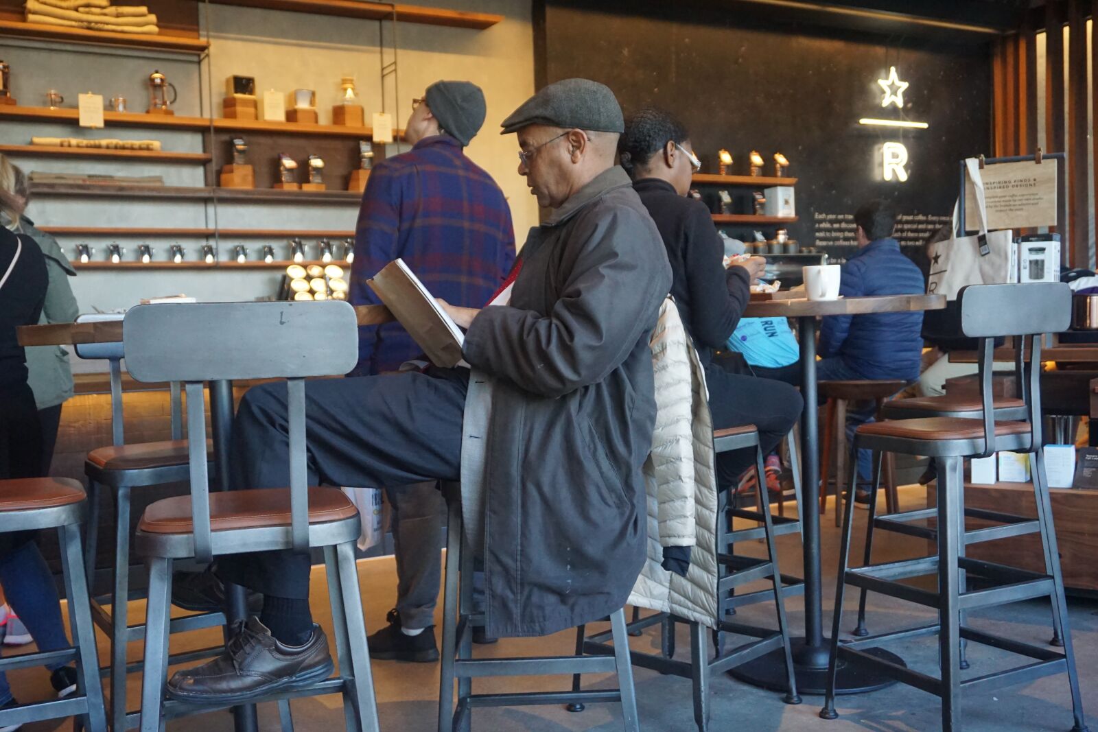 Sony E 16-50mm F3.5-5.6 PZ OSS sample photo. Black man, man, reading photography