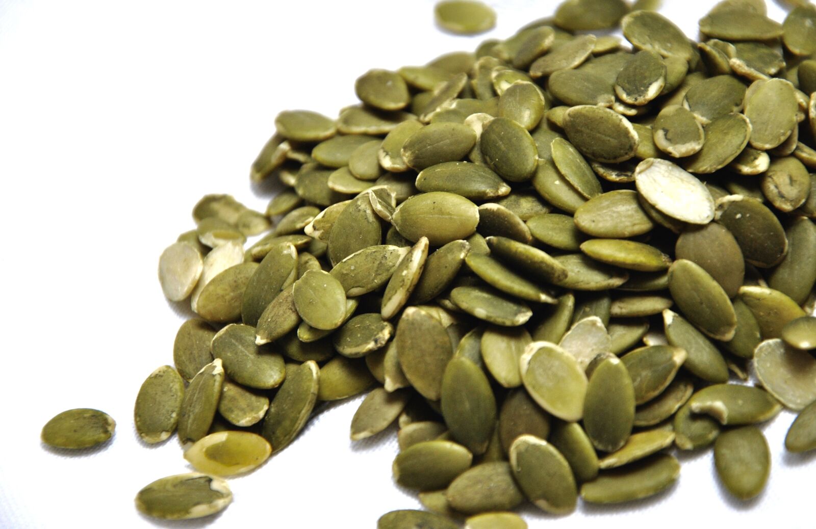 Nikon D3000 sample photo. Pumpkin seeds, kernels, green photography