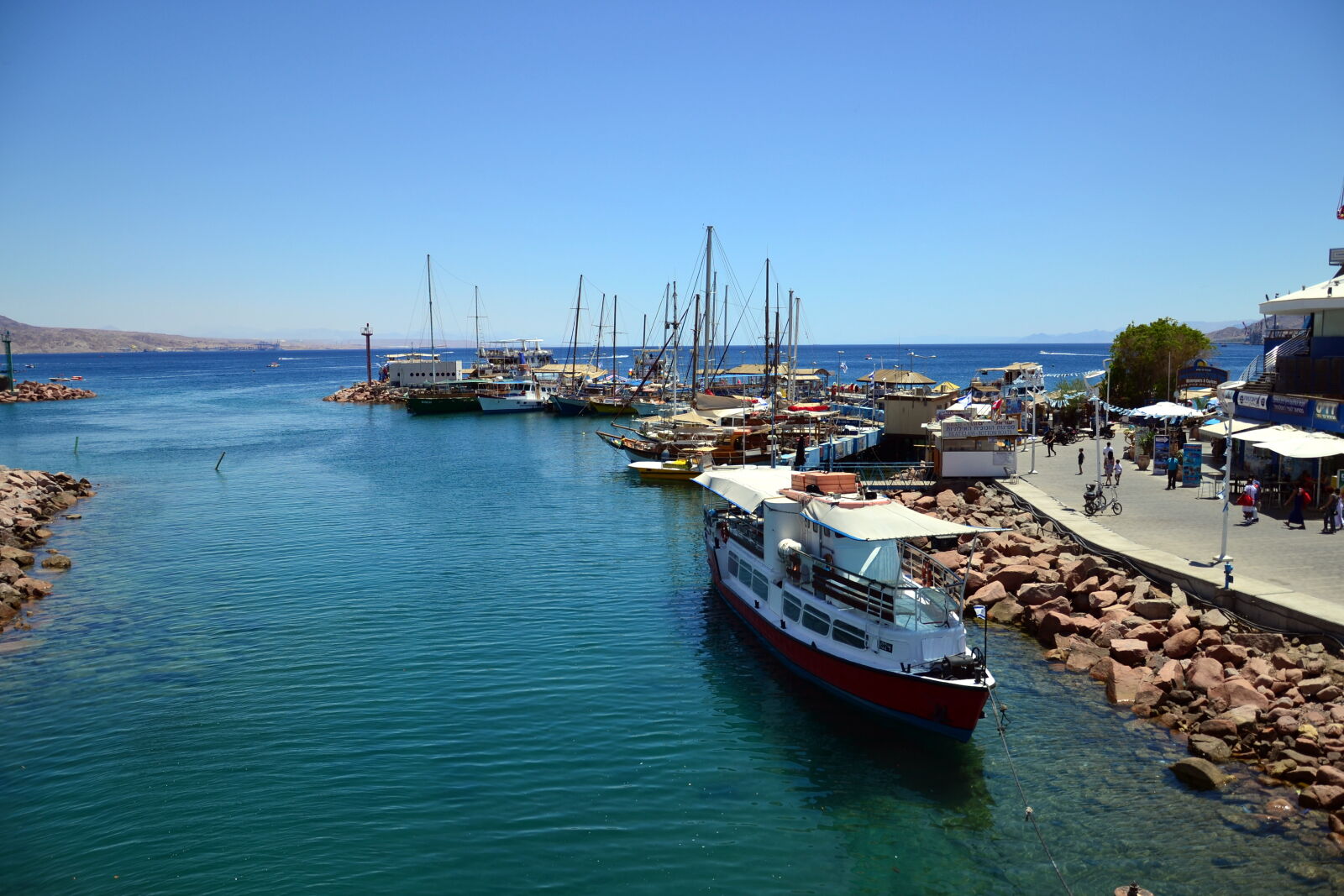 Nikon D3100 sample photo. Boats, red, sea, sea photography