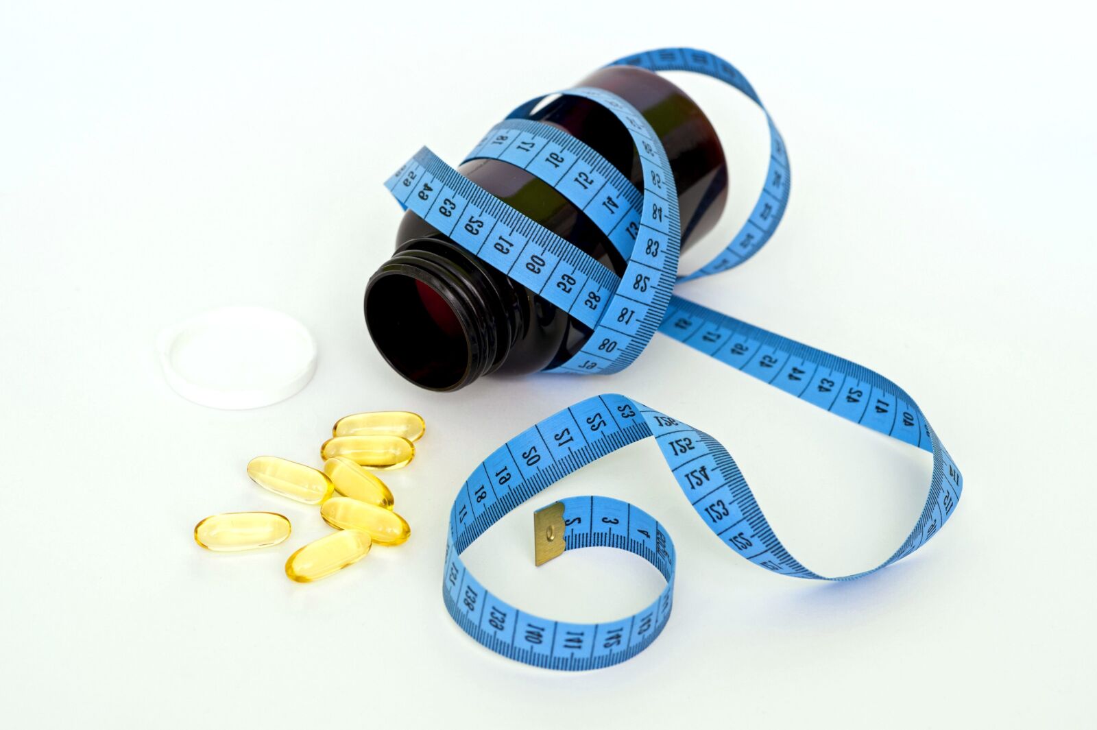 Nikon D700 sample photo. Yellow pills, bottle, measuring photography