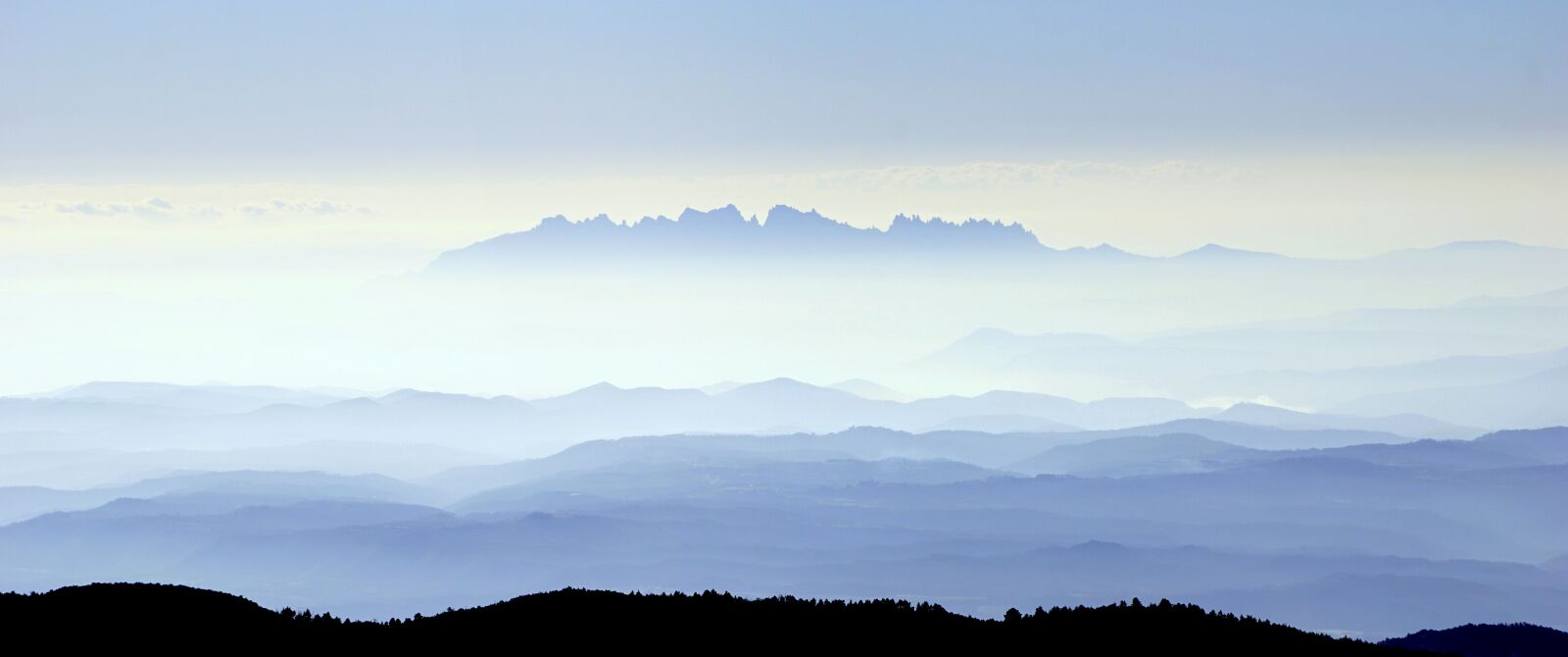Sony E 55-210mm F4.5-6.3 OSS sample photo. Mist, montserrat, landscape photography
