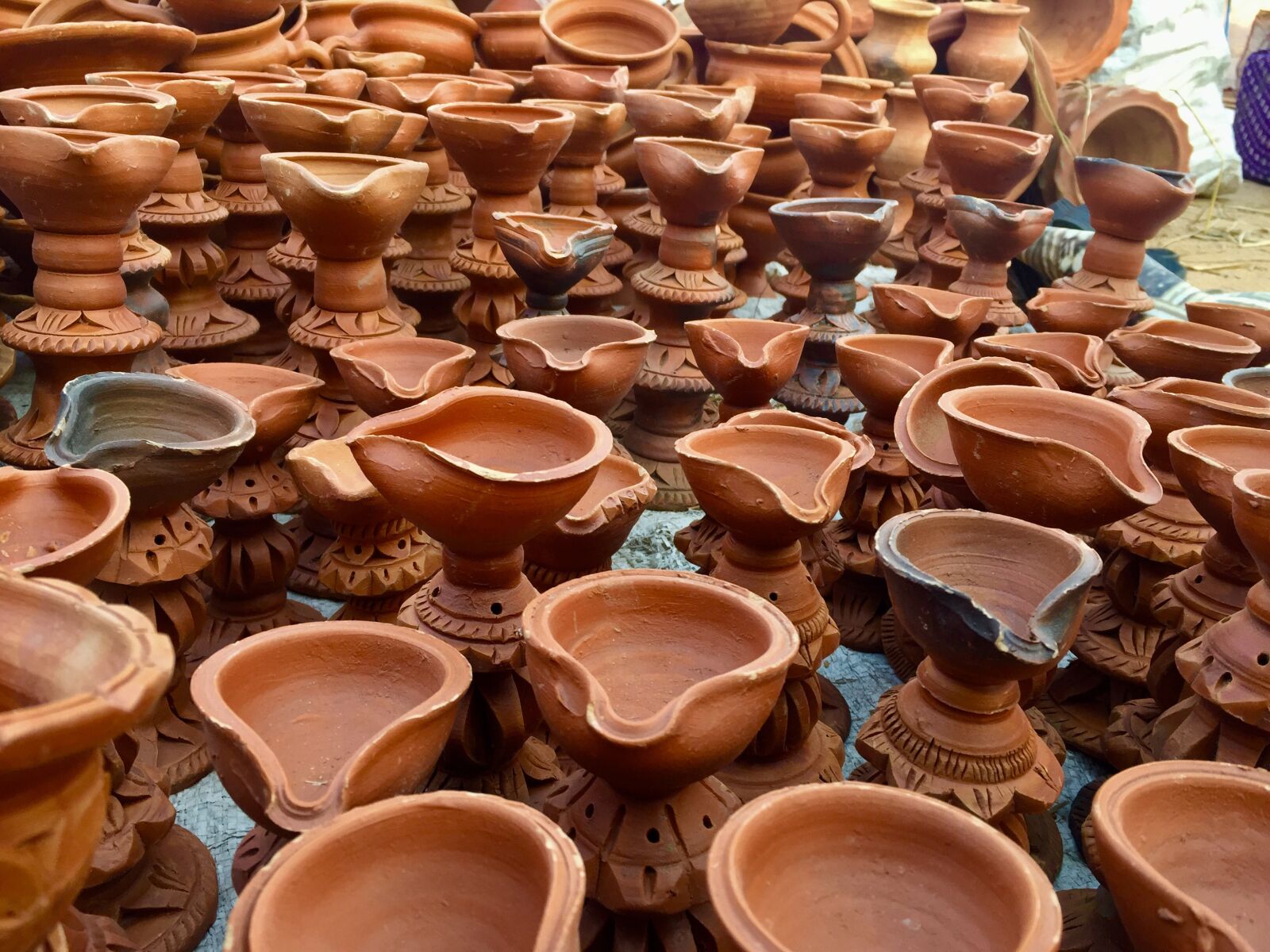 iPhone 6 back camera 4.15mm f/2.2 sample photo. Mud work, light, diwali photography