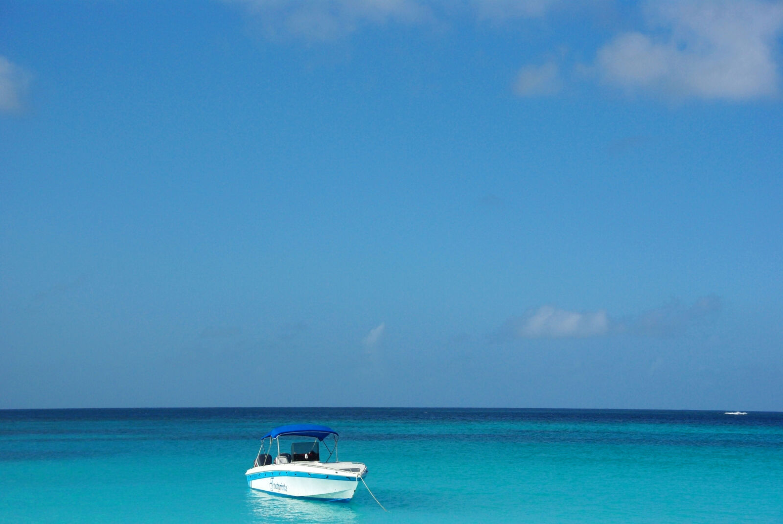 Pentax K200D sample photo. Blue, sea, boat, caribbean photography