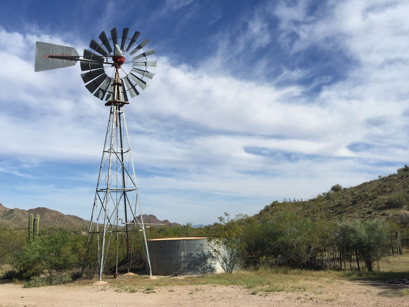 iPhone 6 Plus back camera 4.15mm f/2.2 sample photo. Arizona, windmill, cattle tank photography