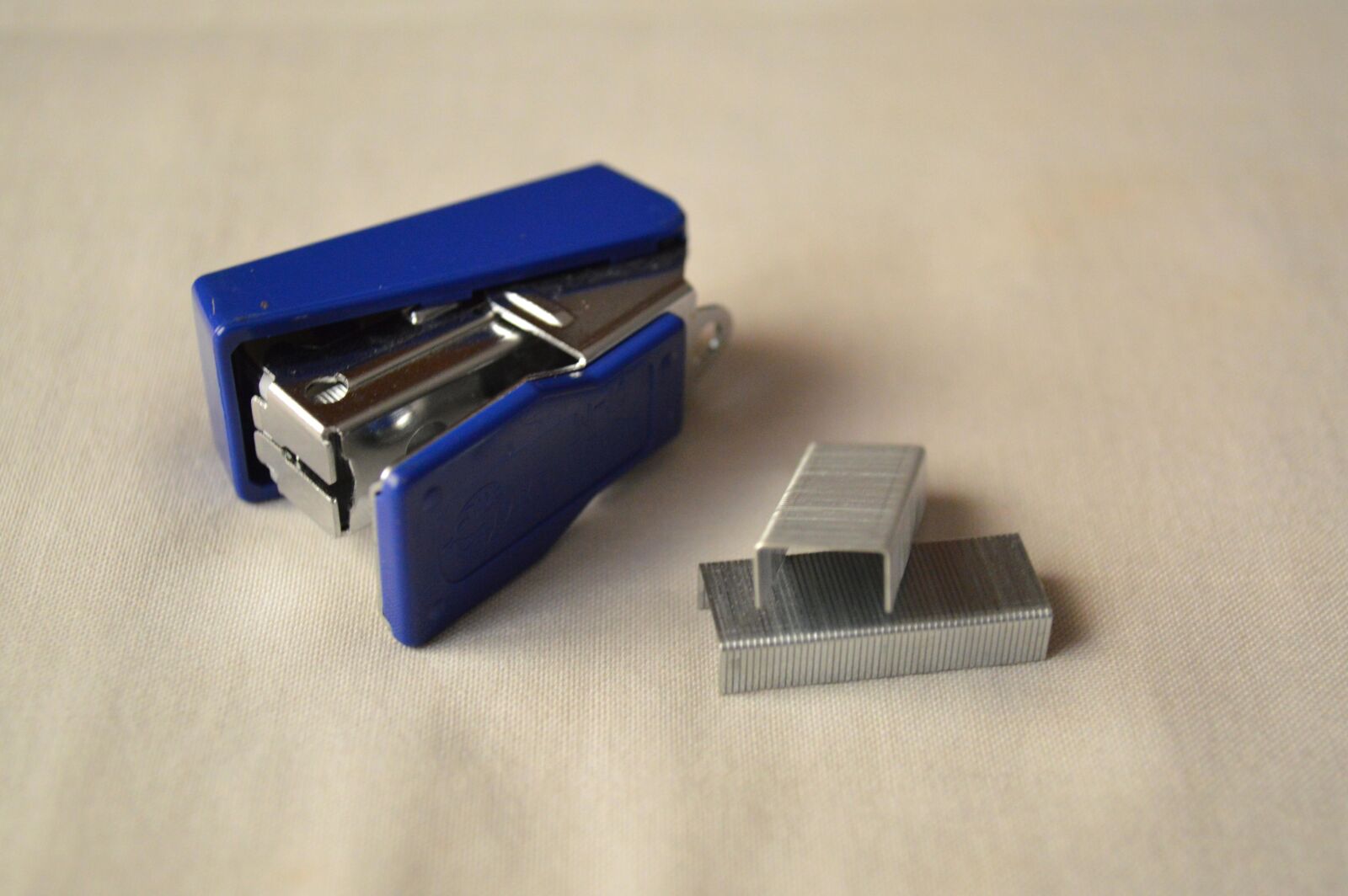 Nikon D3200 sample photo. Steel, object, stapler, hand photography