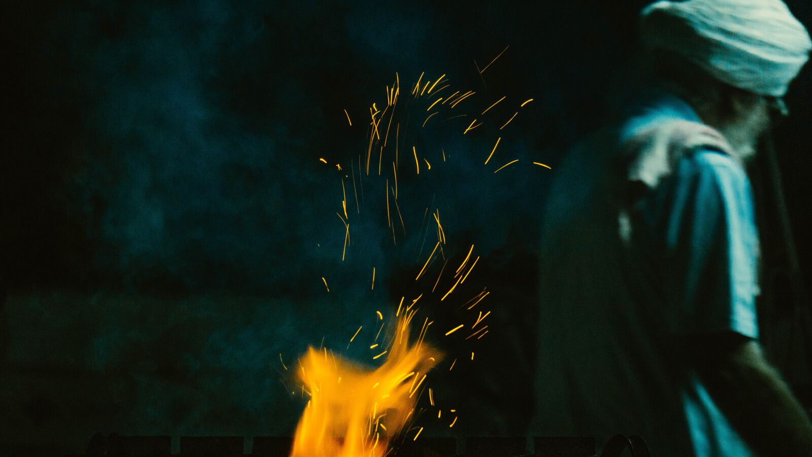 Sony E 55-210mm F4.5-6.3 OSS sample photo. Portrait, long exposure, fire photography