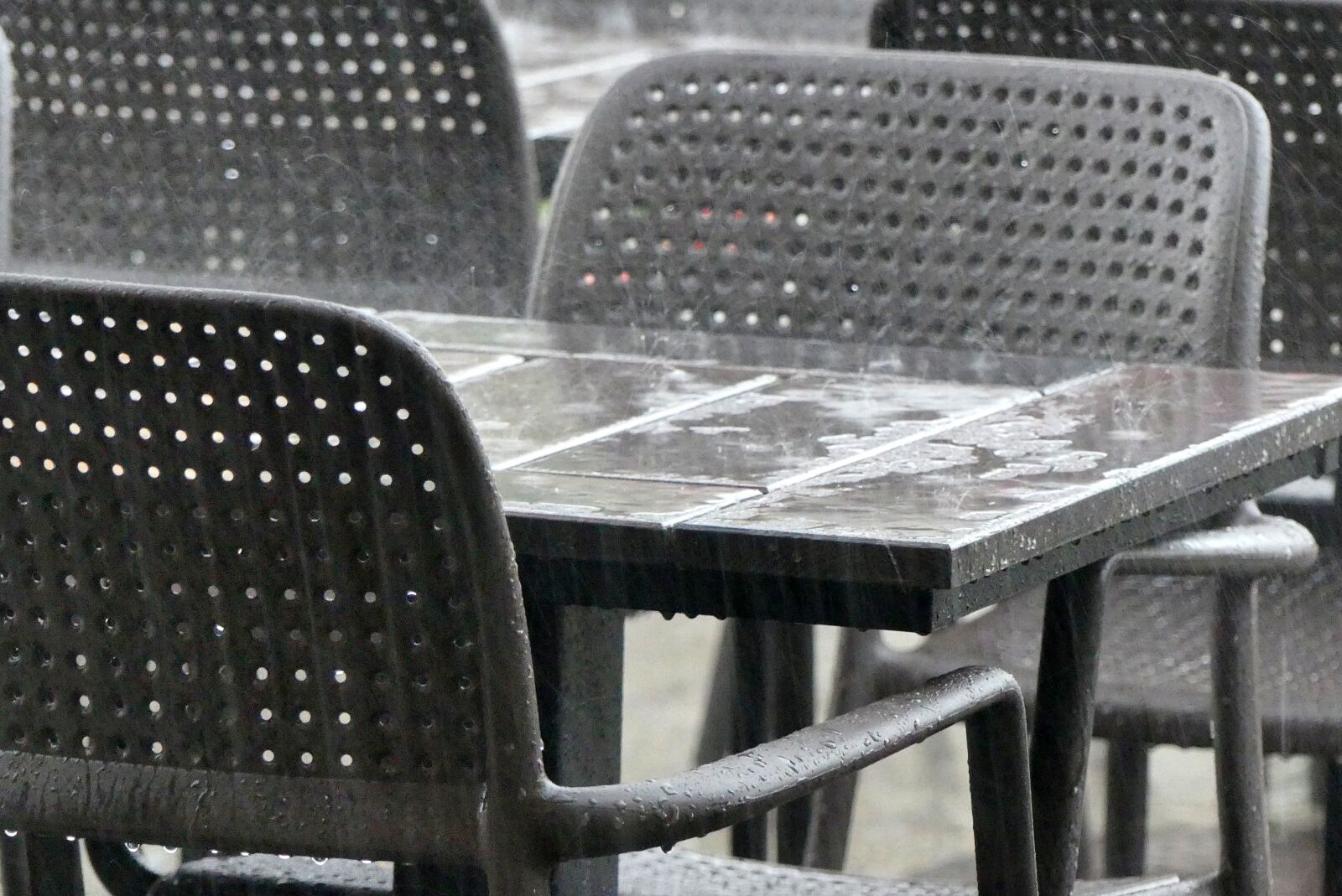 Panasonic Lumix DMC-FZ300 sample photo. Rain, the downpour, chair photography