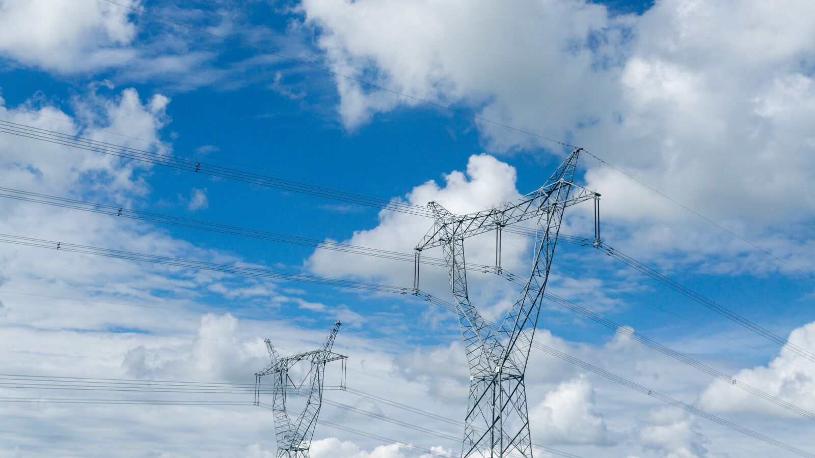 Sony a5100 sample photo. Electric tower, wire, blue photography