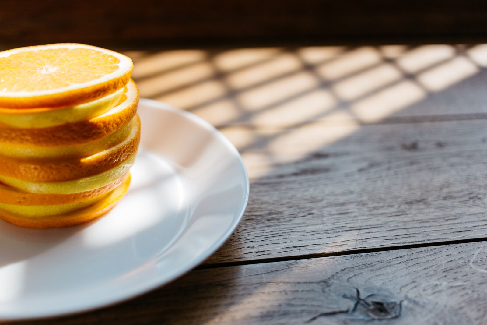 Canon EF 40mm F2.8 STM sample photo. Plate, orange, lemon photography