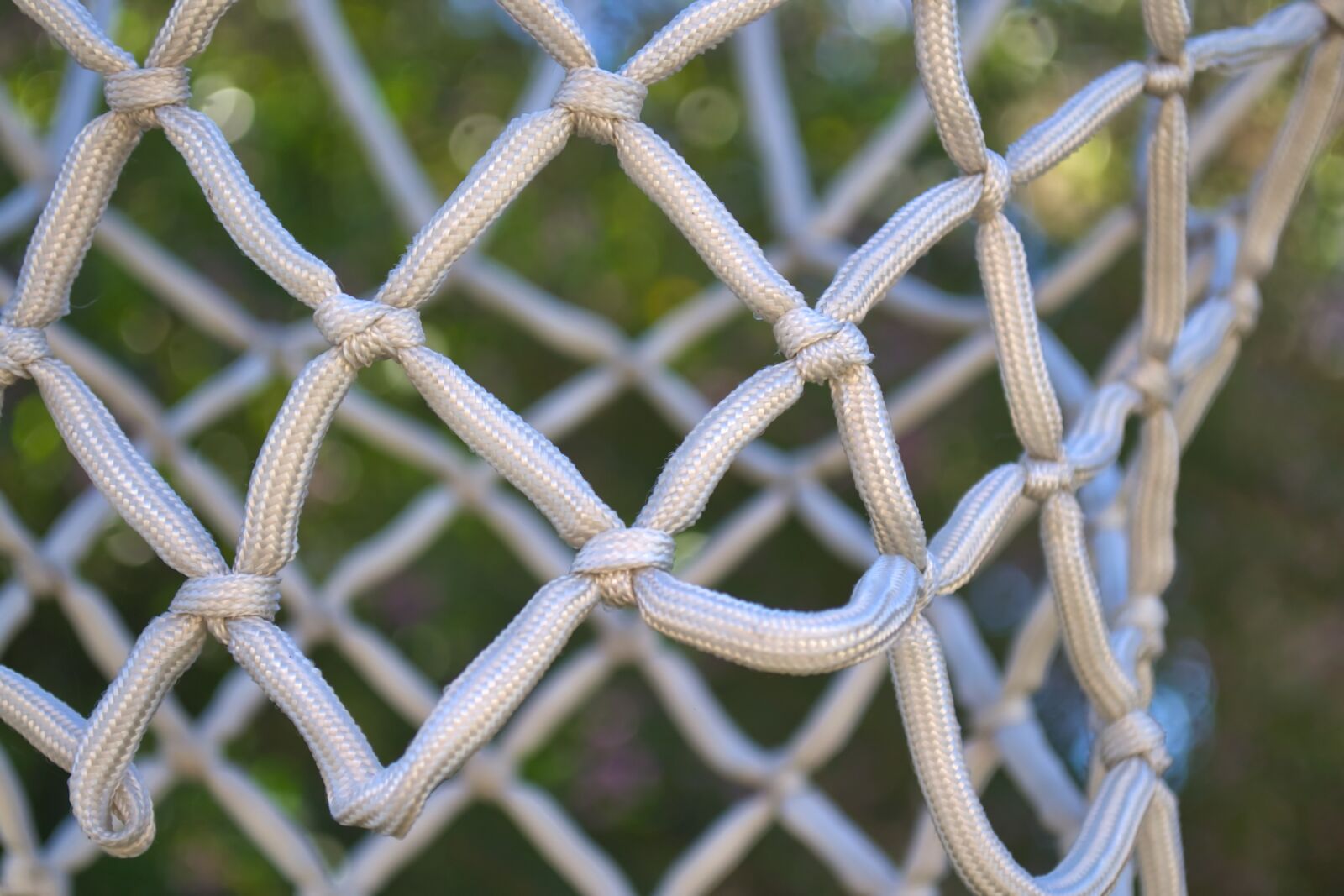Nikon D3100 sample photo. Basketball net, knots, rope photography