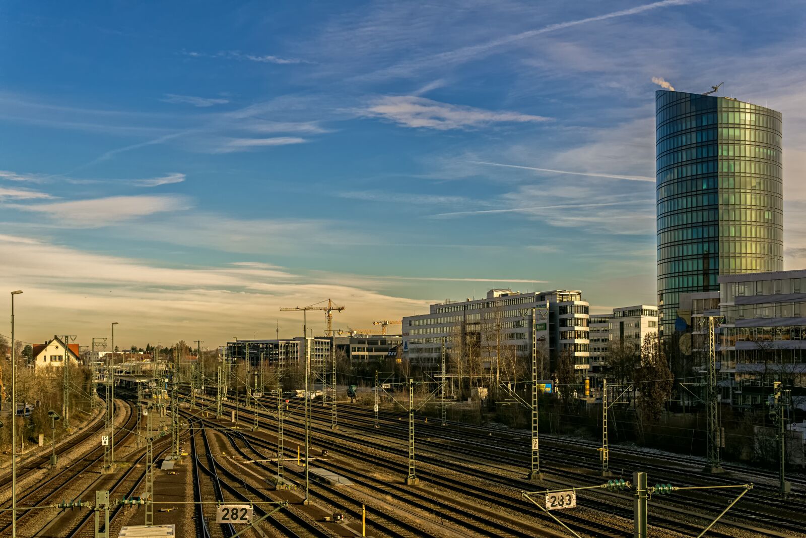 30mm F1.4 DC DN | Contemporary 016 sample photo. Buildings, rails, sky photography