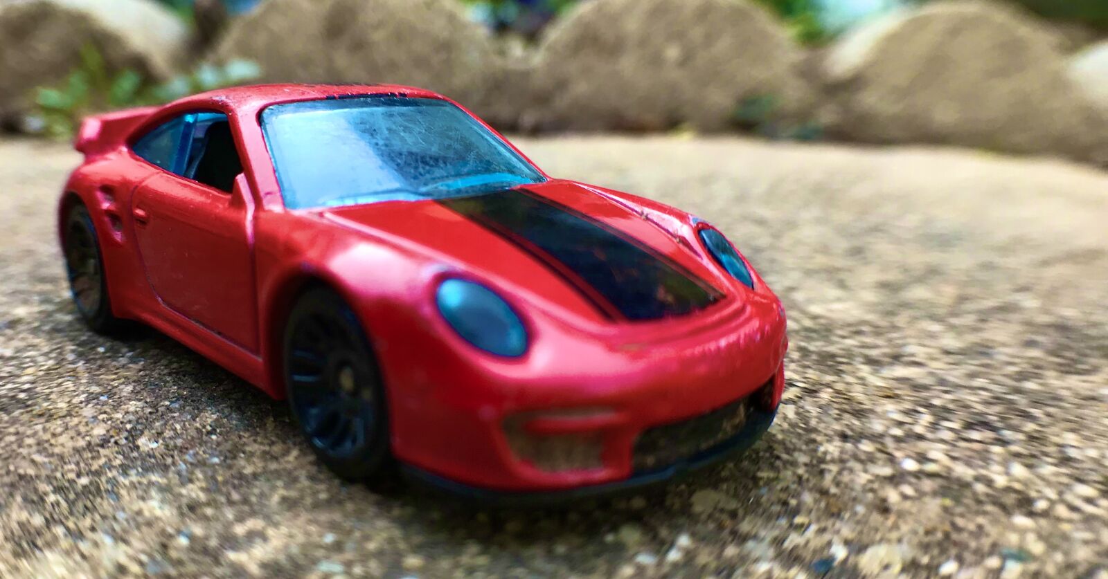 iPhone 7 back camera 3.99mm f/1.8 sample photo. Toy, car, red photography