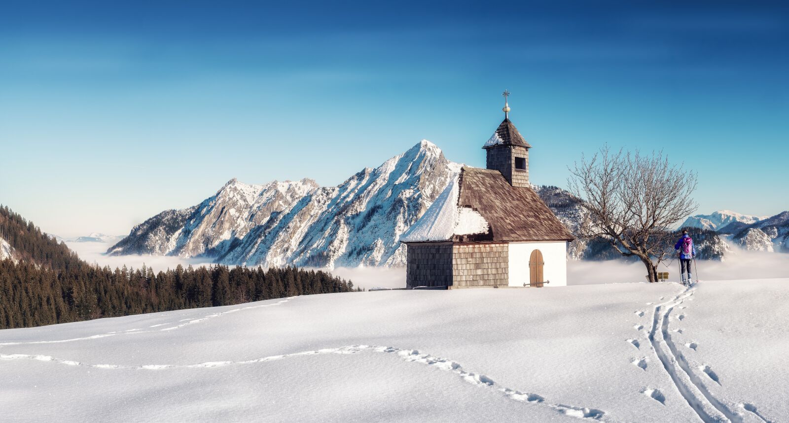 OLYMPUS M.25mm F1.2 sample photo. Chapel, mountains, winter photography