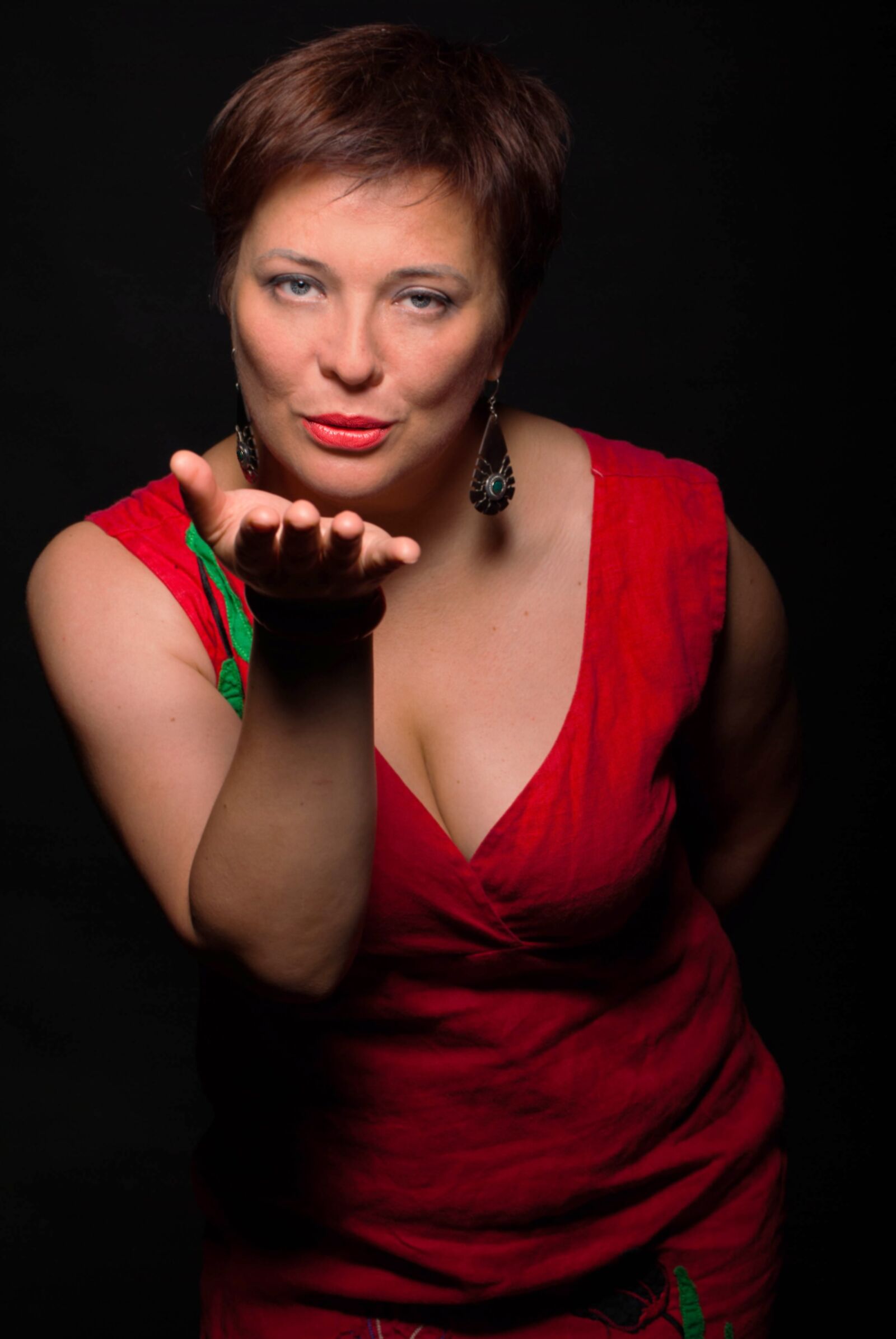 Nikon D3000 sample photo. Woman, red dress, kiss photography