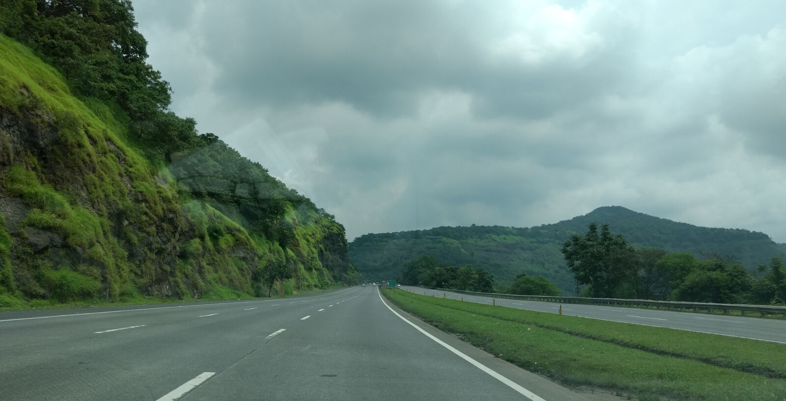 Motorola Moto G (4) sample photo. Drive, gray, sky, mountains photography