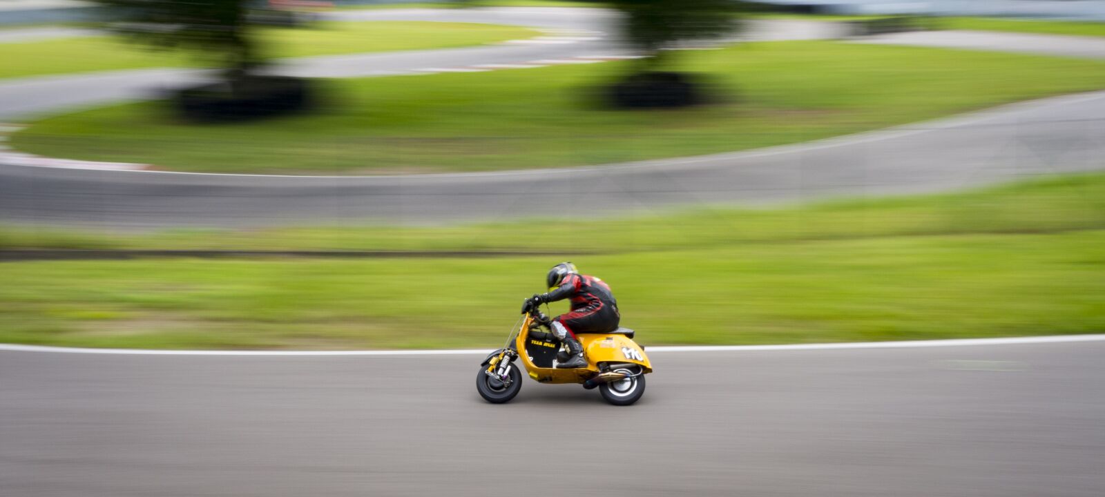 Olympus OM-D E-M10 II sample photo. Vespa, race, exit photography