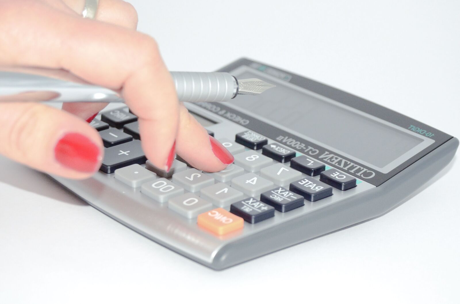 Nikon D5100 sample photo. Pencil, hand, woman, calculator photography