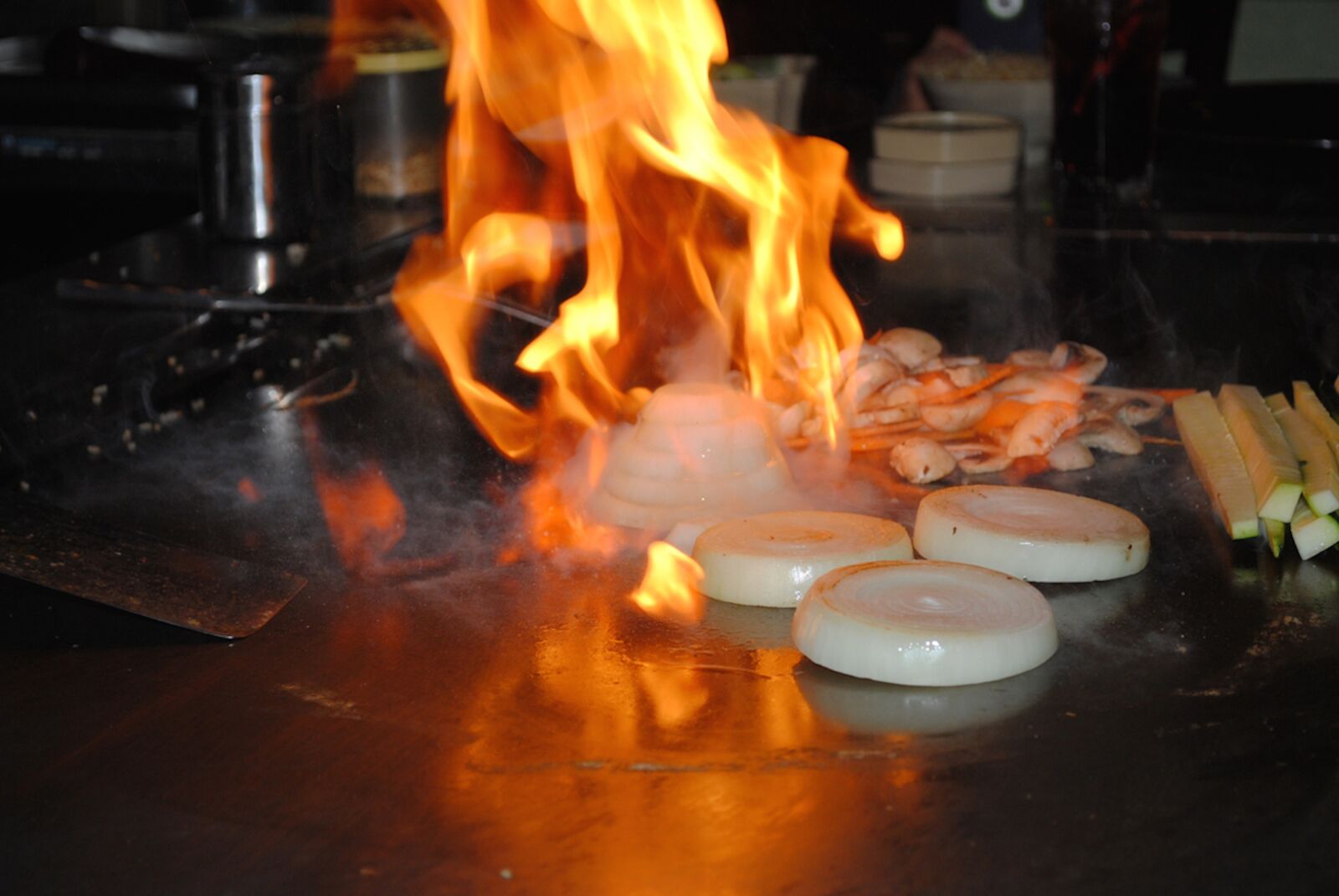 Nikon D3000 sample photo. Flaming onion, onion, hibachi photography