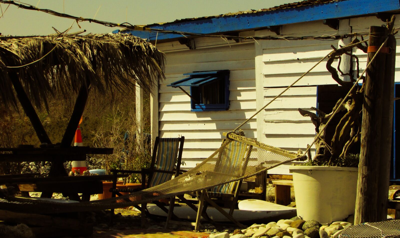 Canon PowerShot SX400 IS sample photo. Hut, rough, beach photography