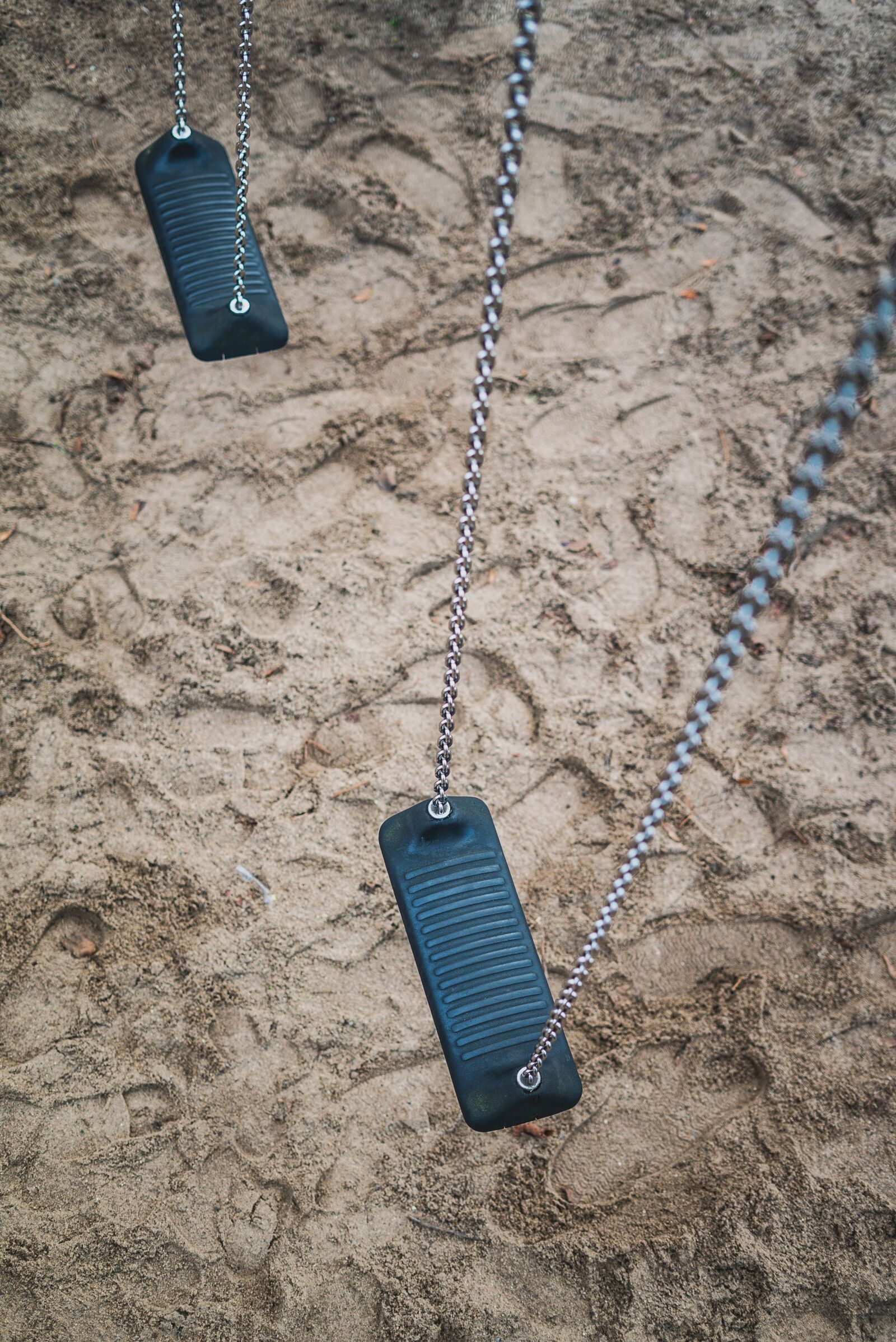 Sony a7S II + Sony FE 50mm F1.8 sample photo. Swing, playground, rock photography