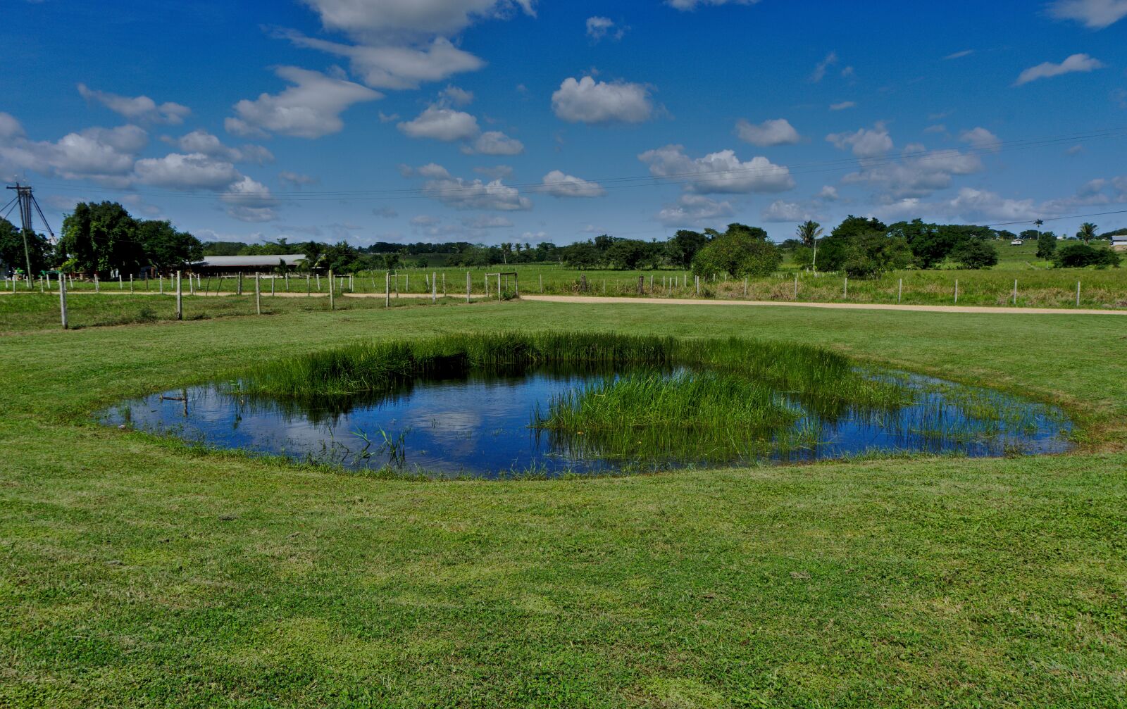Sony E 16-50mm F3.5-5.6 PZ OSS sample photo. Pond, landscape, grass photography