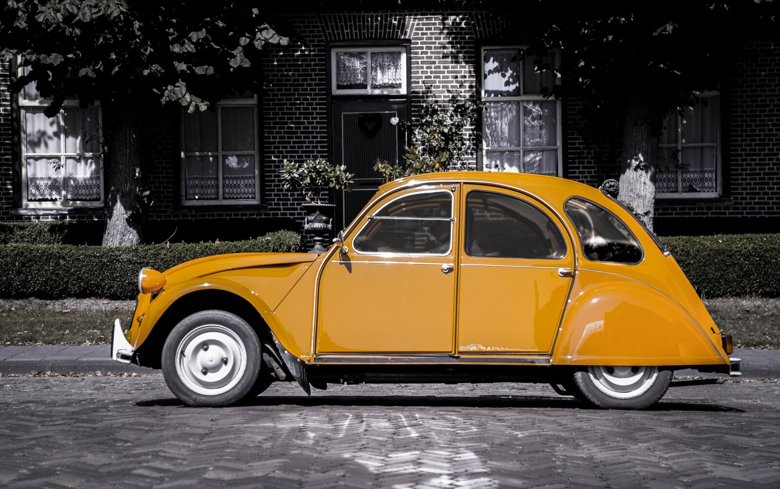 Nikon D610 sample photo. Car, orange, grayscale photography
