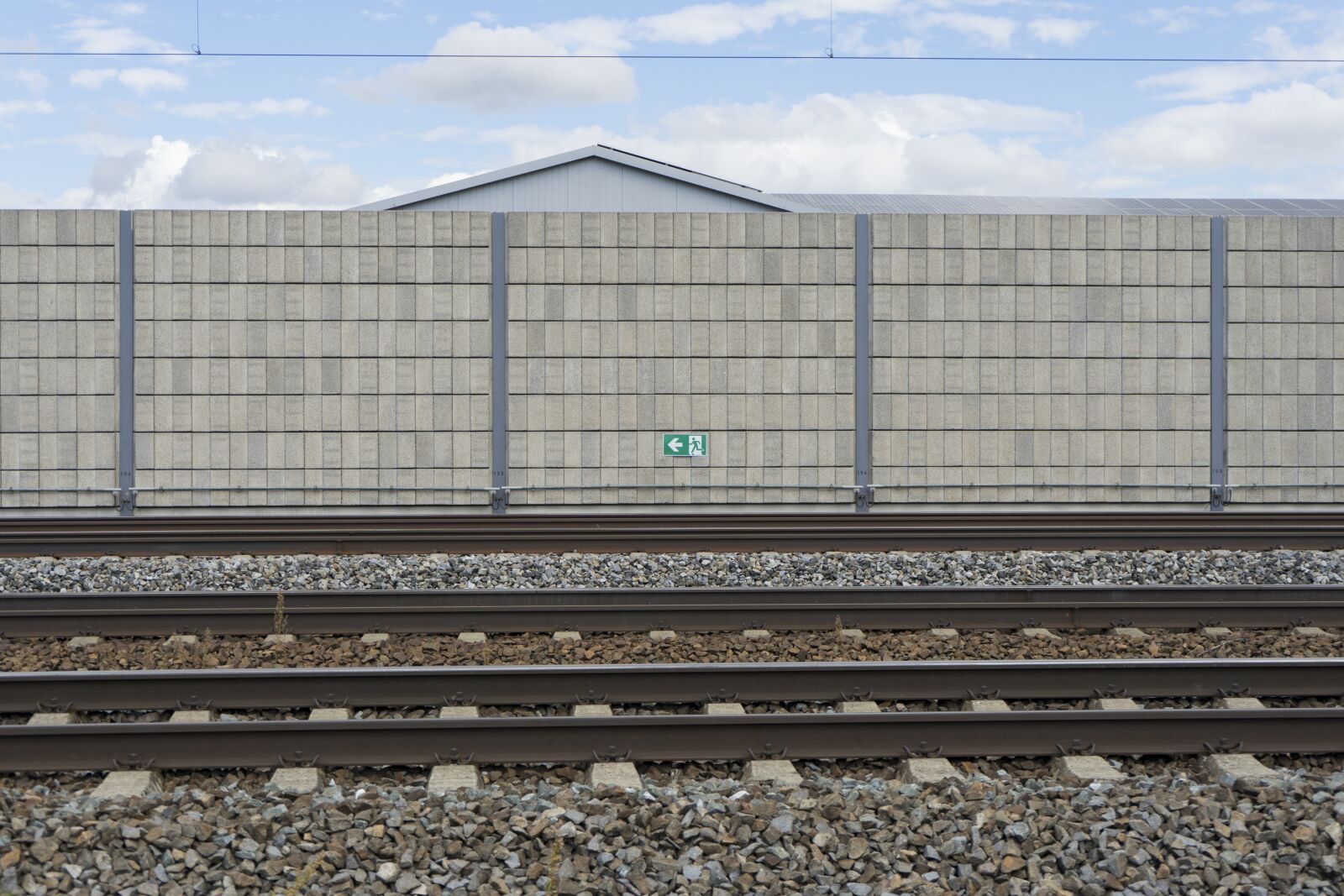 Sony a7 II + Sony FE 28-70mm F3.5-5.6 OSS sample photo. Emergency exit, railway tracks photography