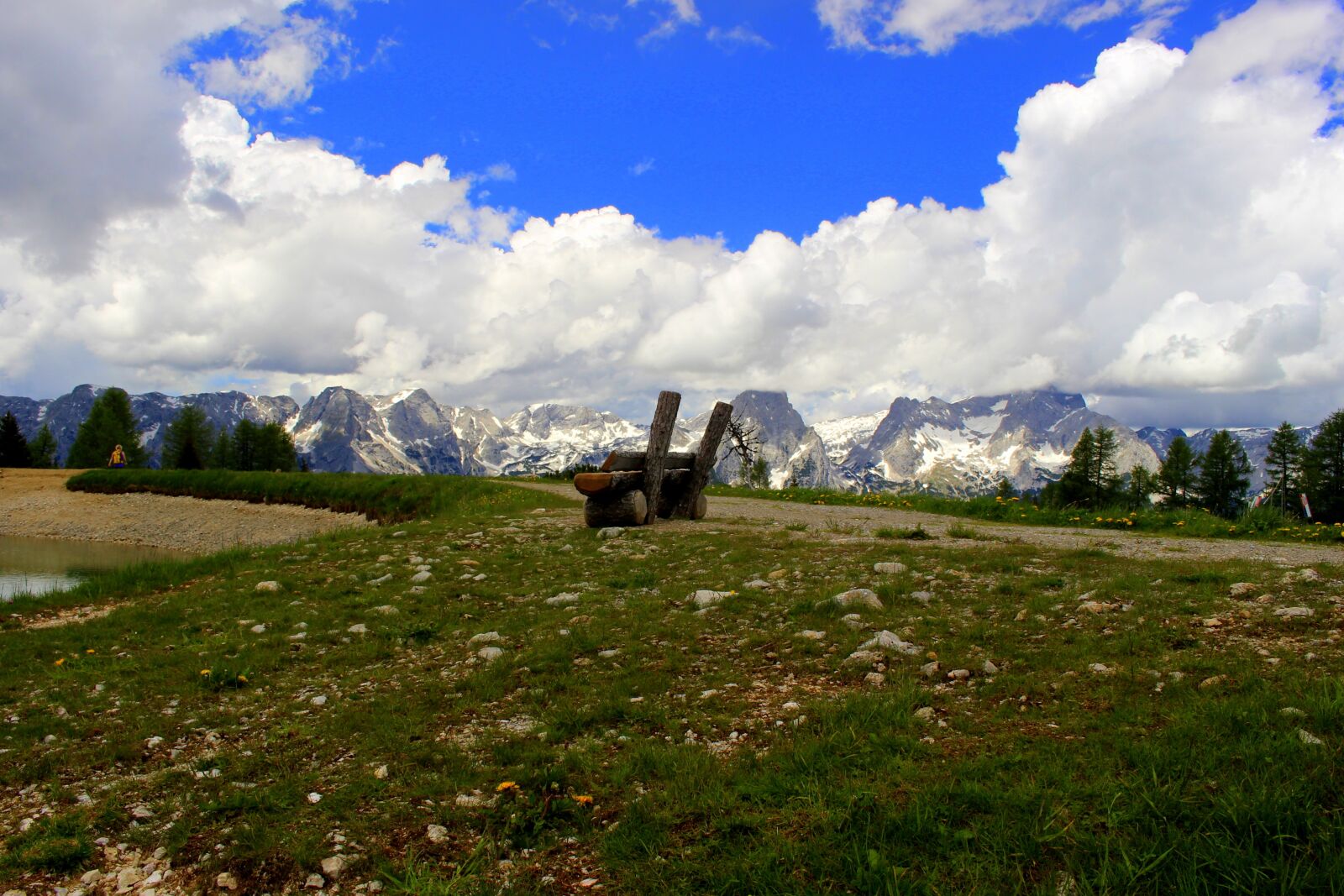 Canon EOS 100D (EOS Rebel SL1 / EOS Kiss X7) sample photo. Mountains, clouds, wooden bench photography
