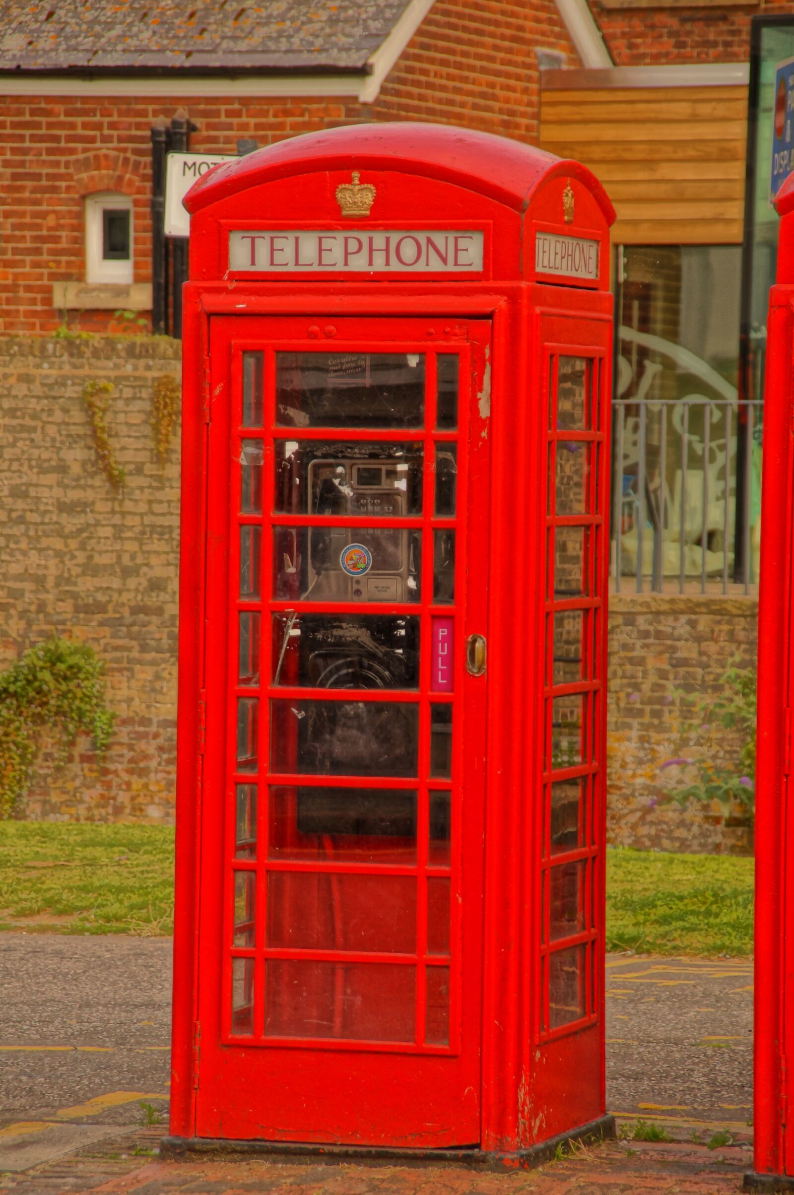 Sony SLT-A57 sample photo. Telephone, booth, red photography