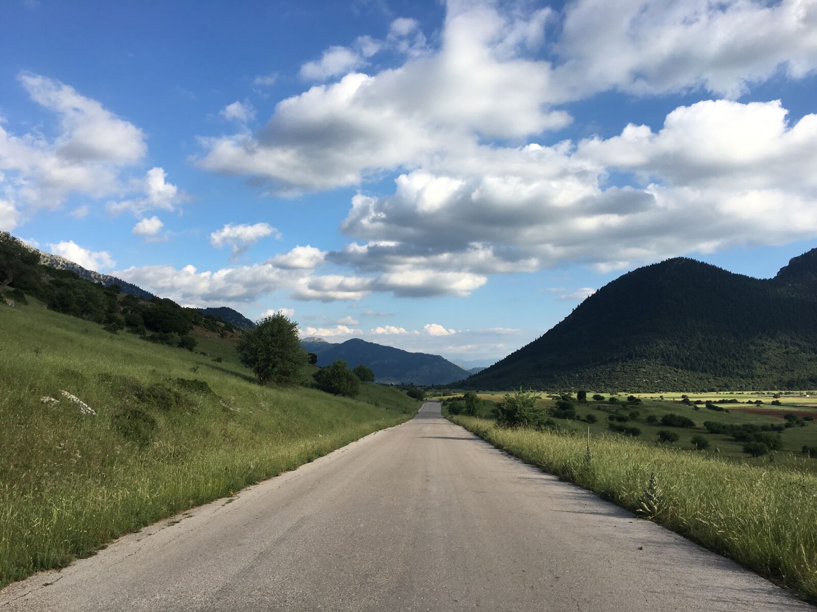 iPhone 6s back camera 4.15mm f/2.2 sample photo. Clouds, endless, fields, greece photography