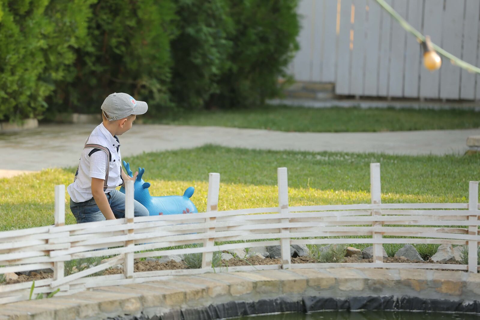Canon EOS 5D Mark III sample photo. Picket fence, boy, playful photography