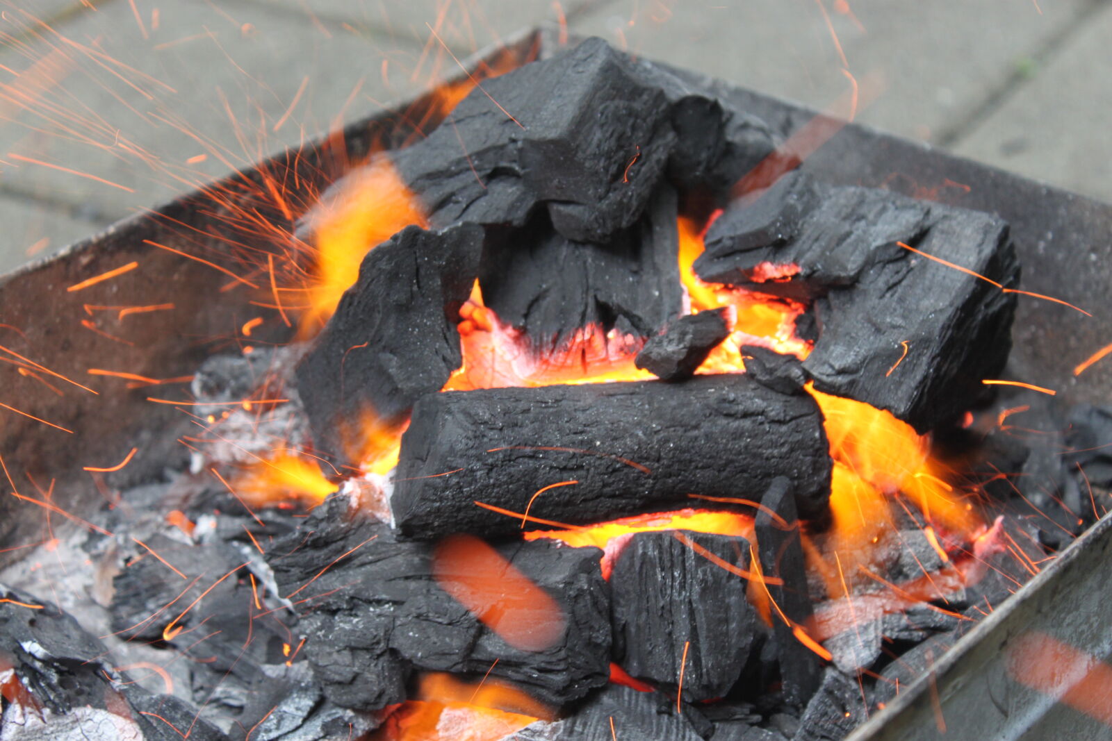 Canon EF-S 18-55mm F3.5-5.6 IS sample photo. Charcoal, fire photography