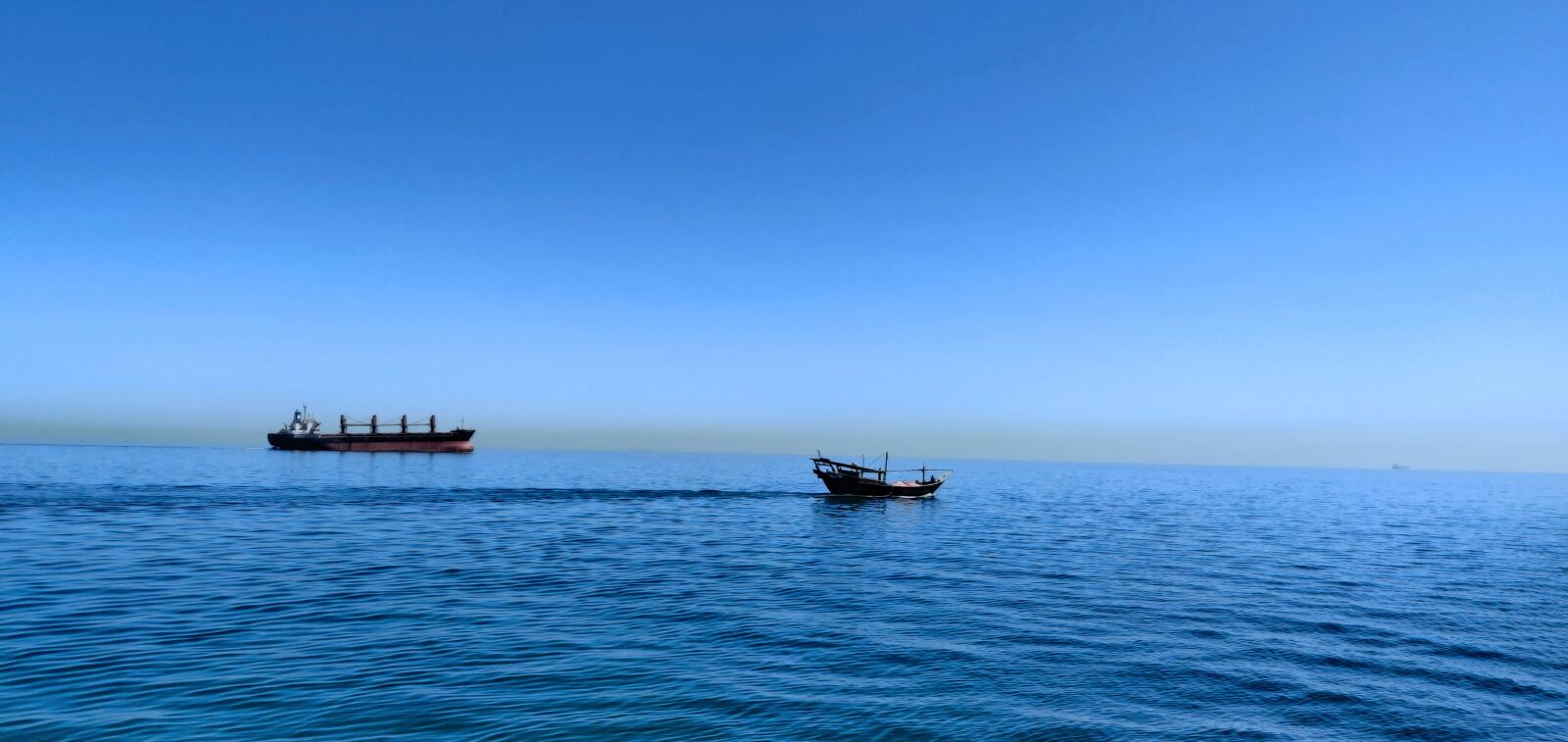 OnePlus GM1901 sample photo. Fishing boat, sky, sea photography