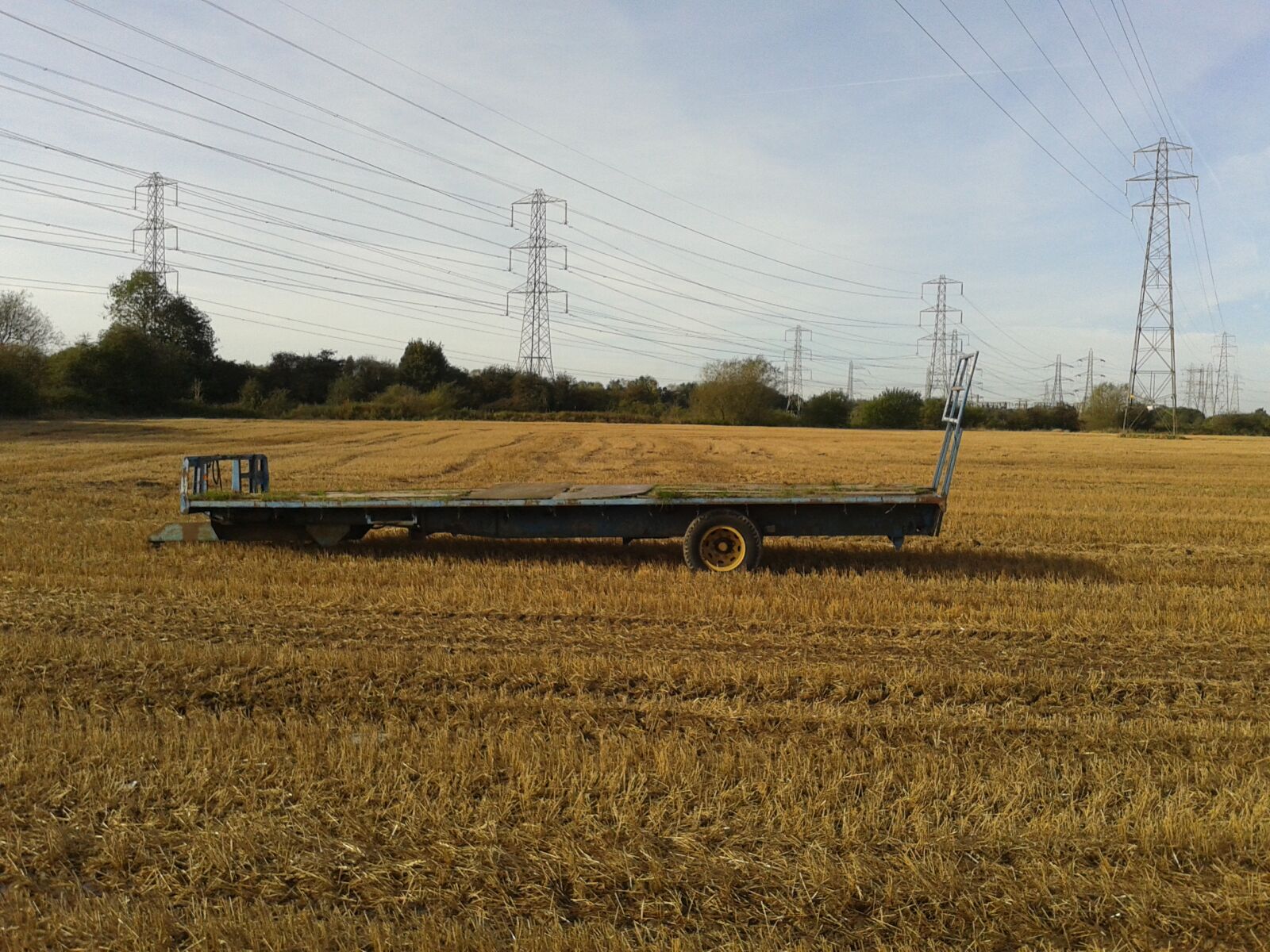 Samsung Galaxy Fame sample photo. Field, pylons, tractor, trailer photography