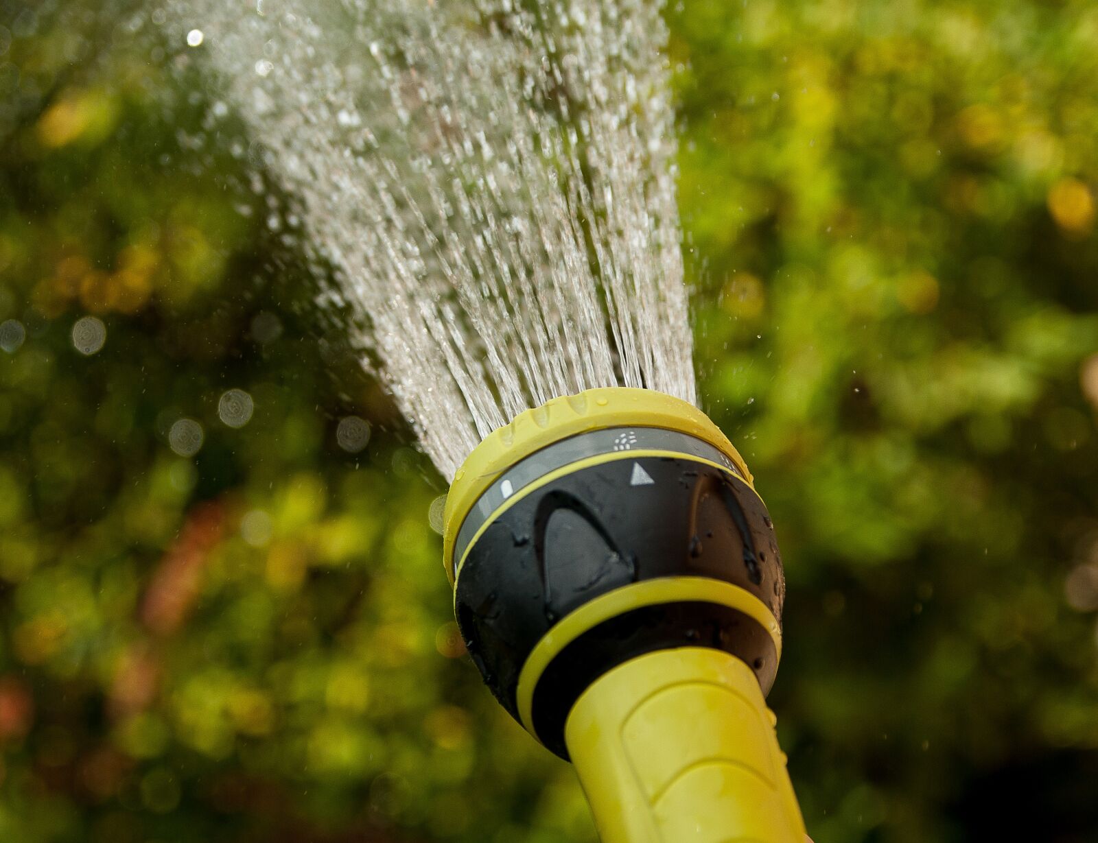Pentax K10D sample photo. Watering, water jet, gardener photography