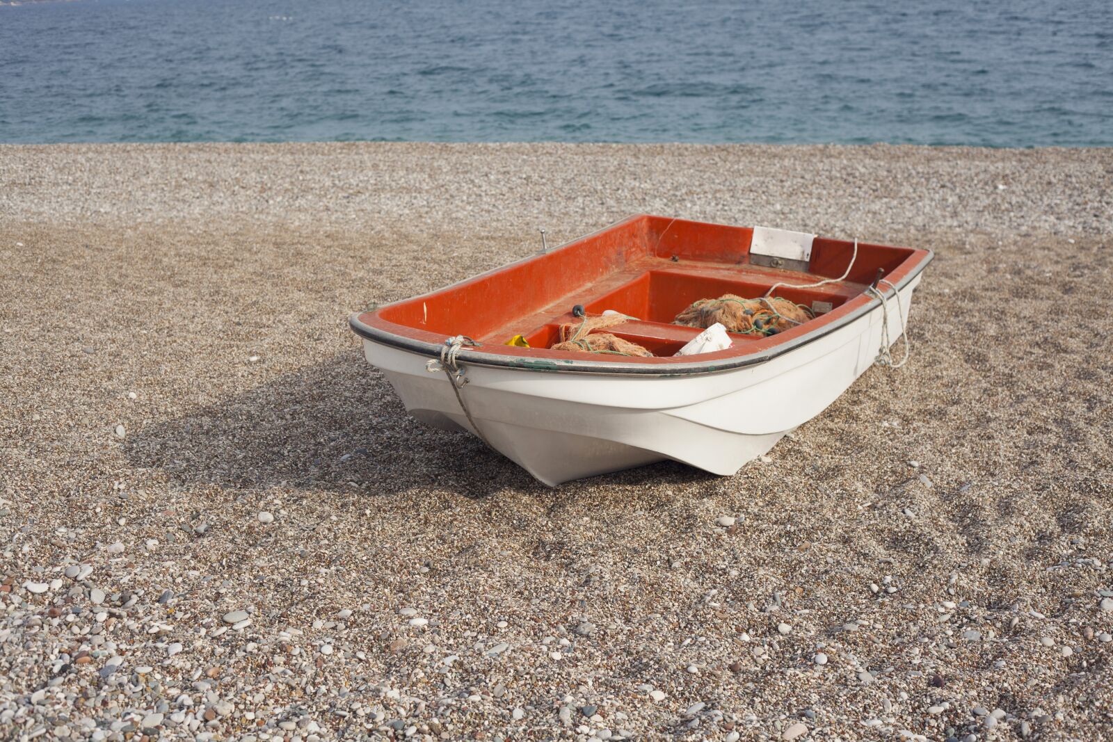 Canon EF 50mm F1.8 II sample photo. Boat, boots, water photography