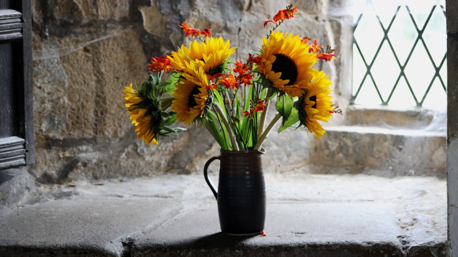 Canon EF 75-300mm f/4-5.6 USM sample photo. Sunflowers, church, vase photography