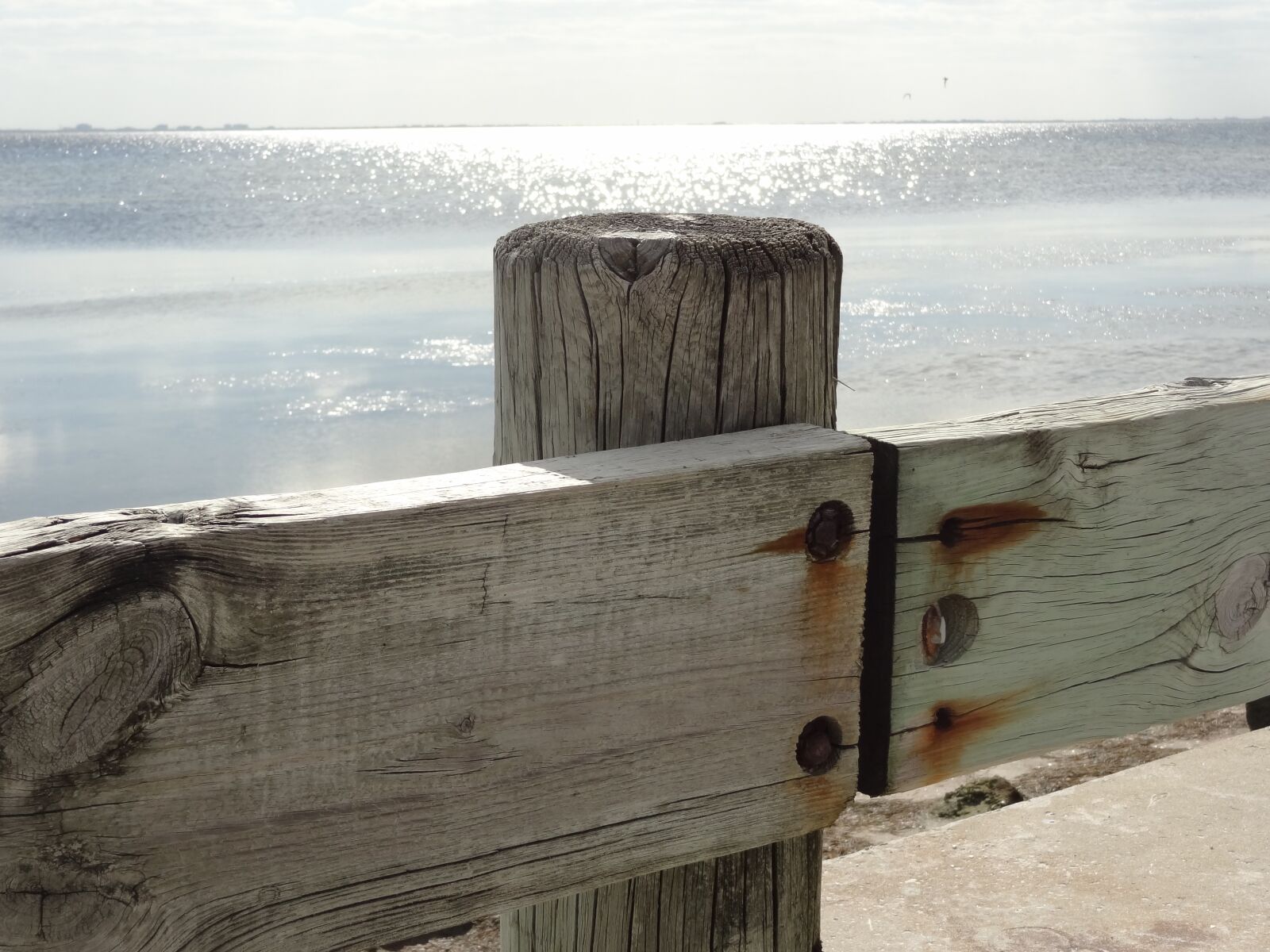 Sony Cyber-shot DSC-HX9V sample photo. Ocean, fence, water photography
