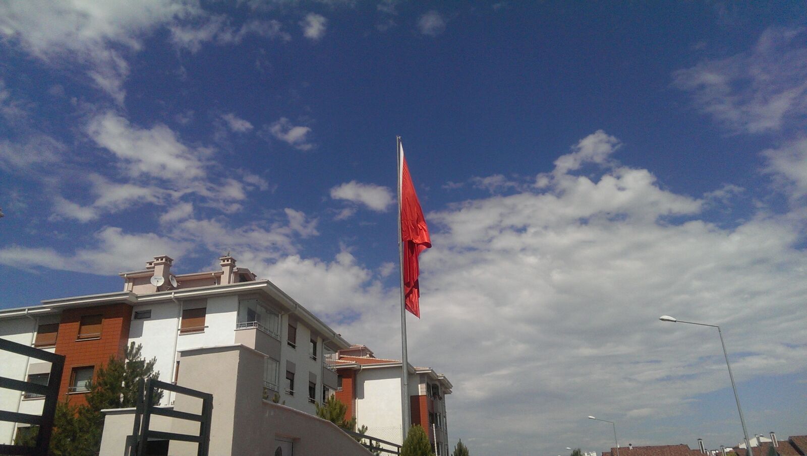HTC ONE sample photo. Red, flag, on, gray photography