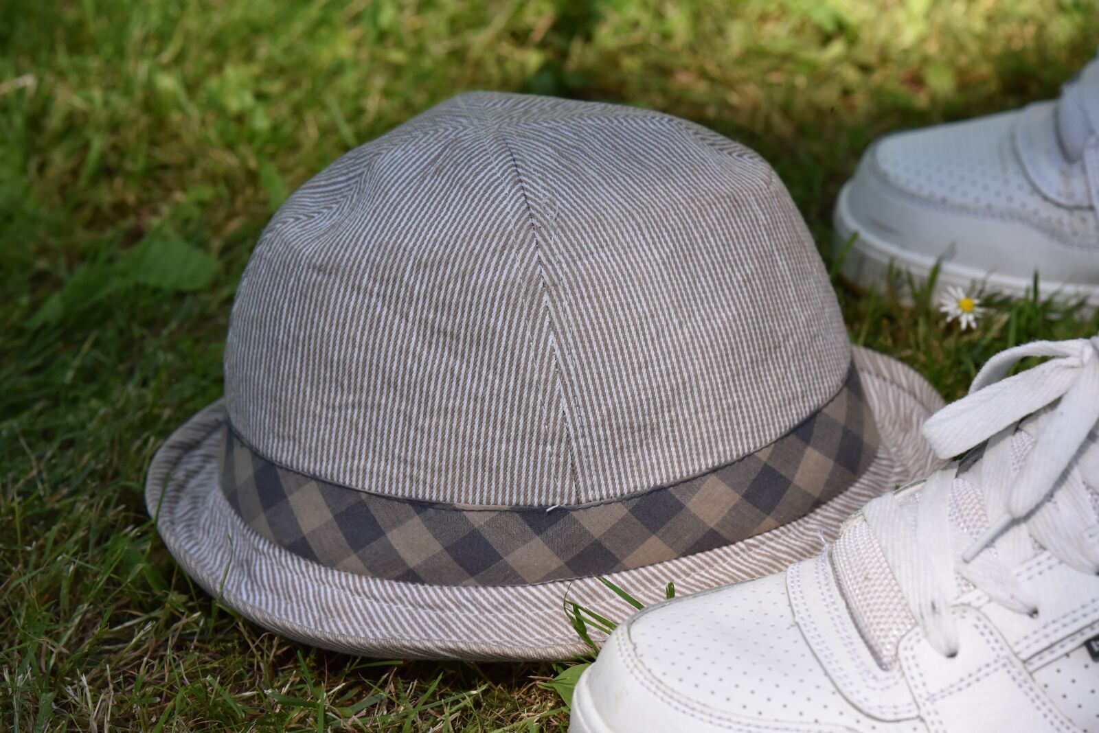 Nikon D810 sample photo. Hat, grass, earthy photography