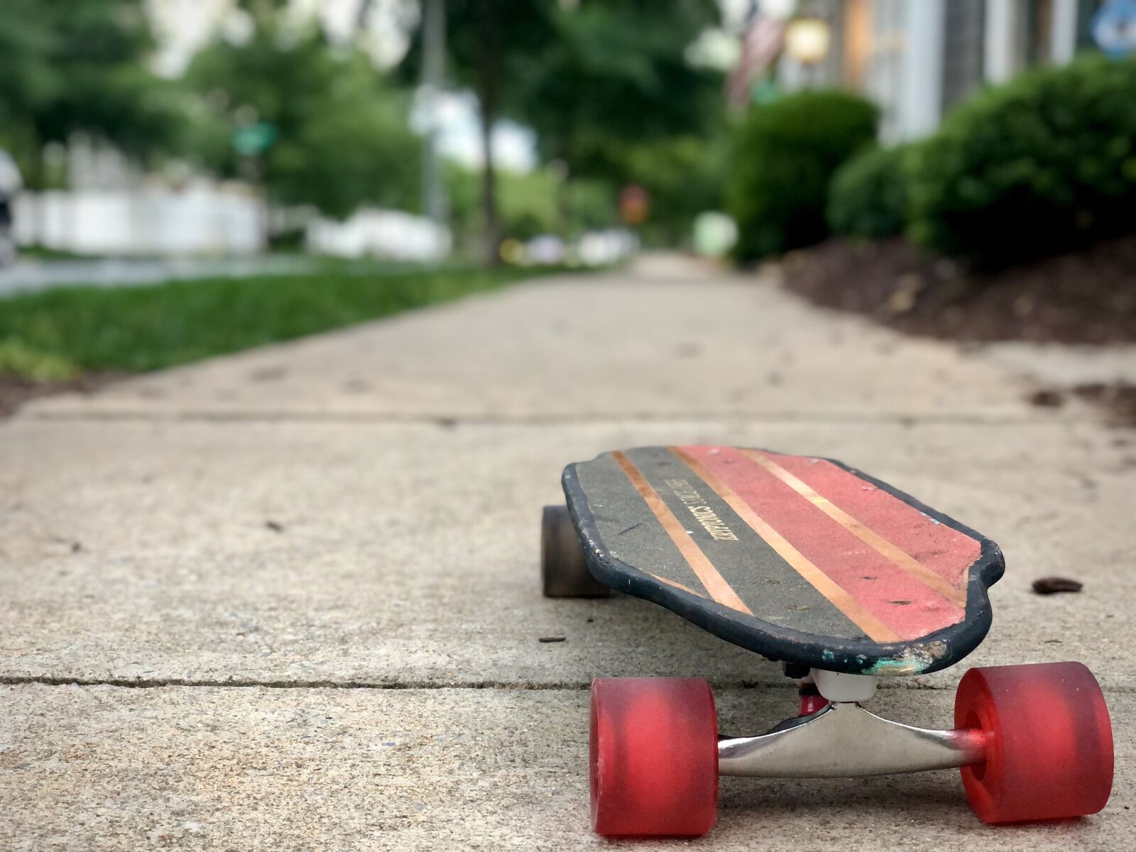 iPhone X back dual camera 6mm f/2.4 sample photo. Skateboard, sidewalk, pavement photography