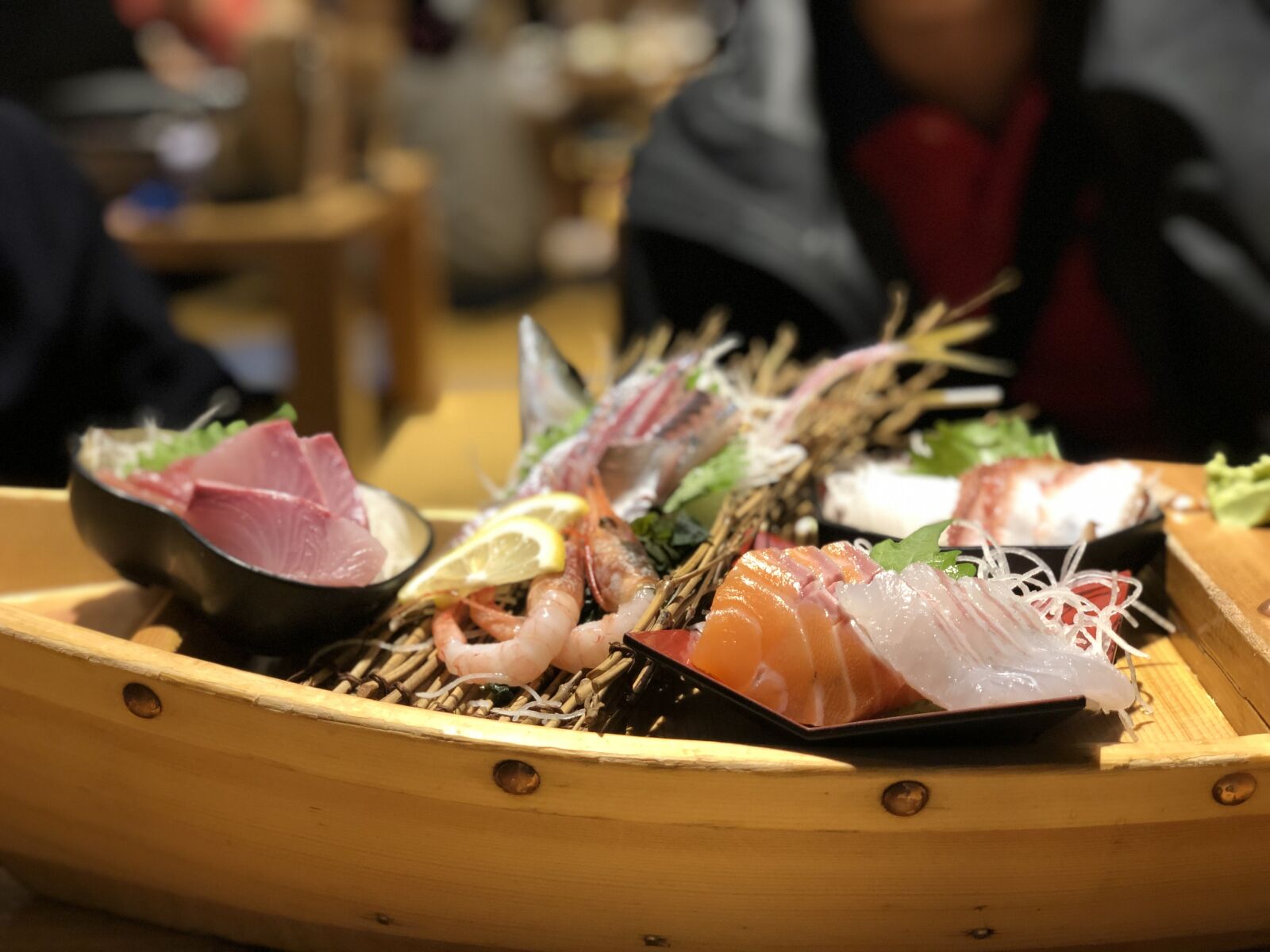 iPhone X back dual camera 6mm f/2.4 sample photo. Fish, boat, sashimi photography
